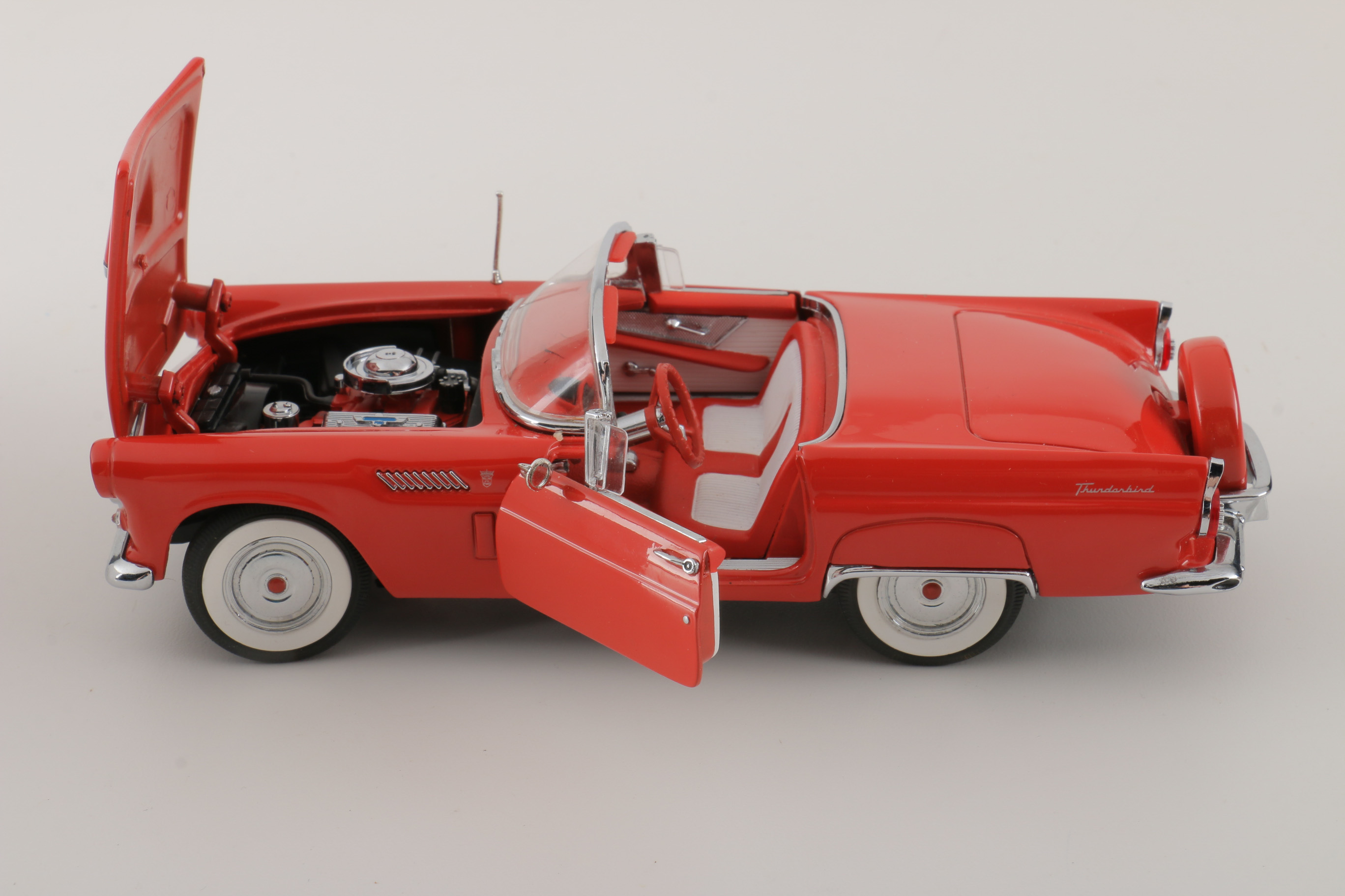 A collection of Four 1:24 Scale Ford Thunderbirds