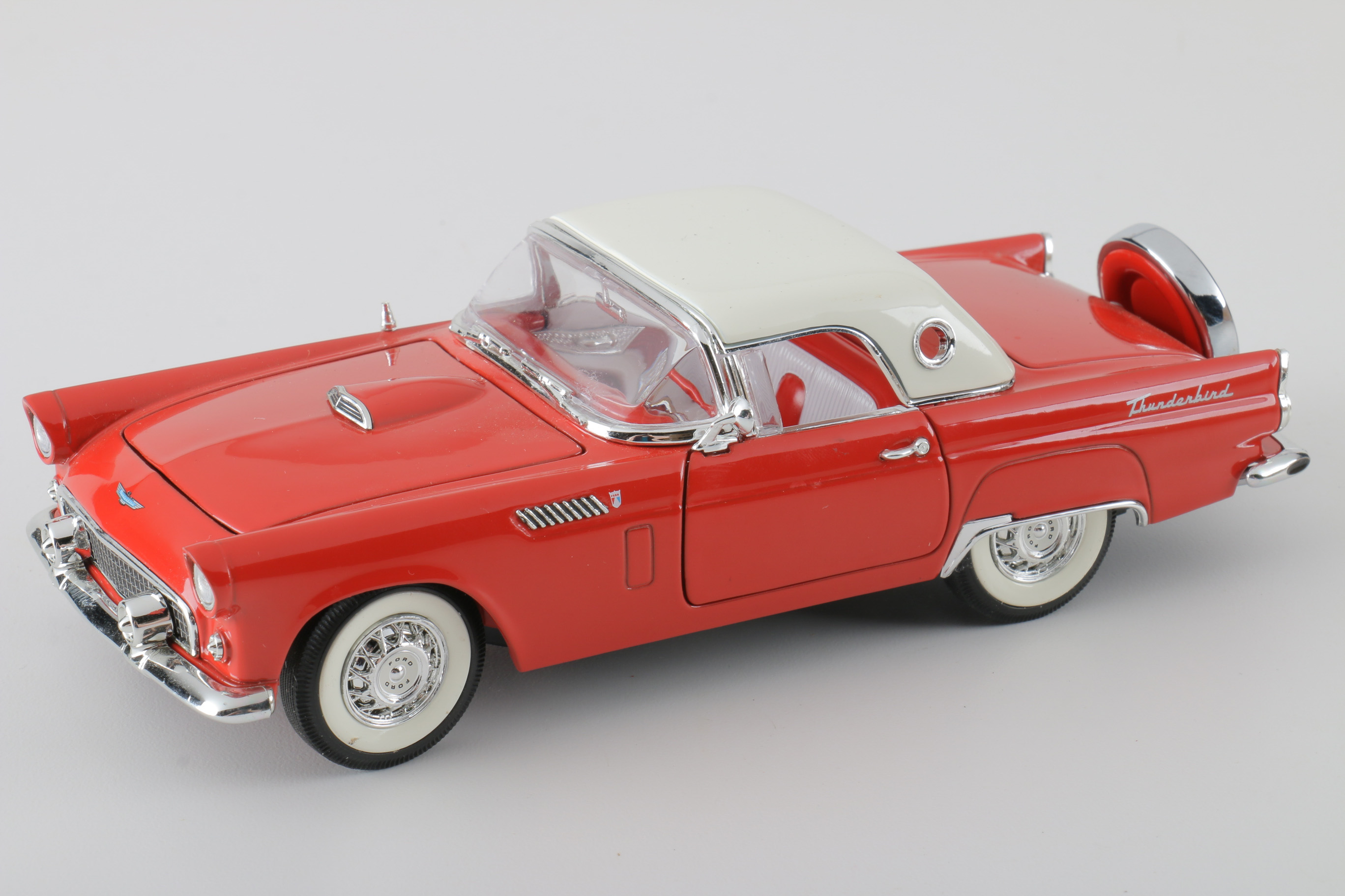 A collection of Four 1:24 Scale Ford Thunderbirds
