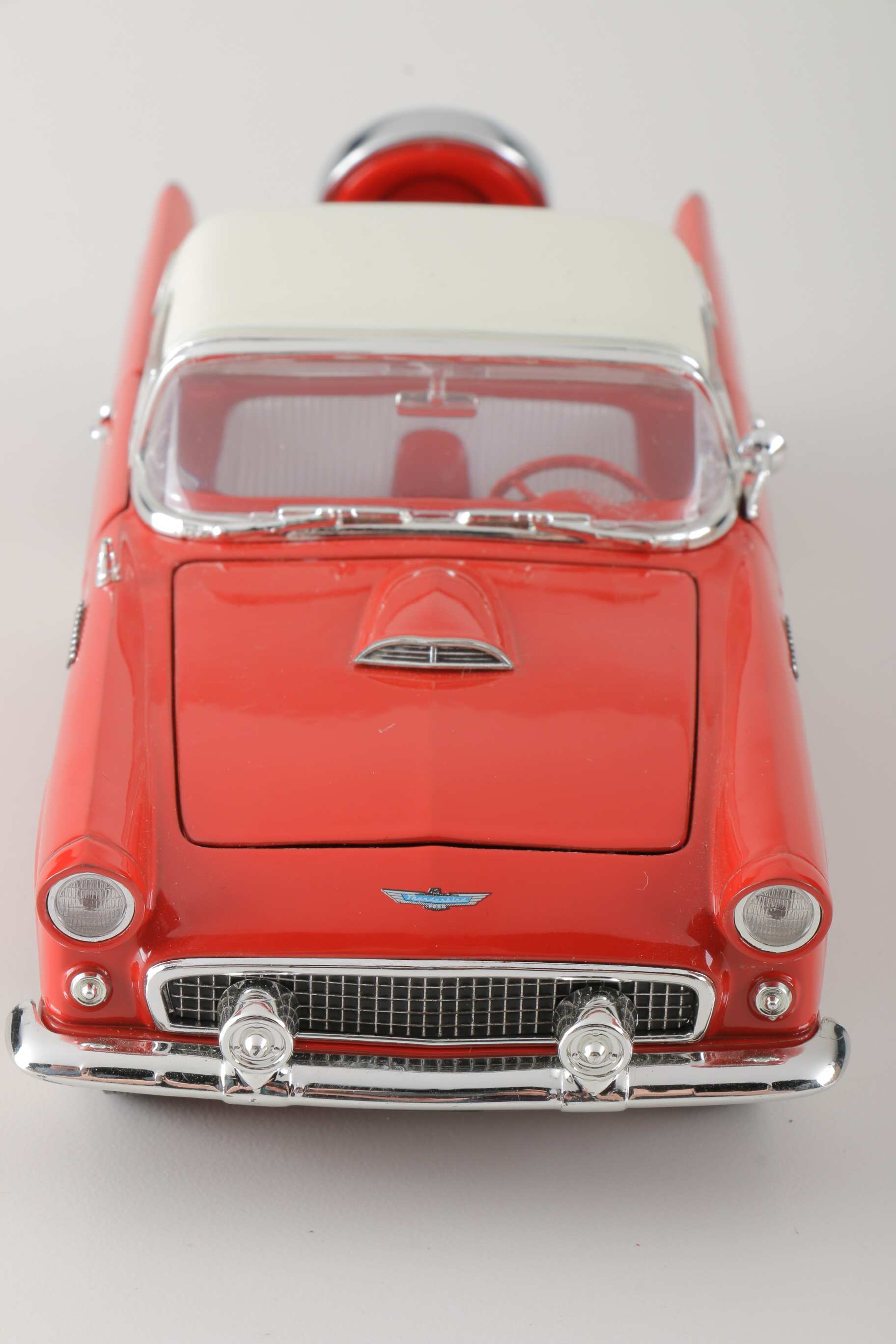 A collection of Four 1:24 Scale Ford Thunderbirds