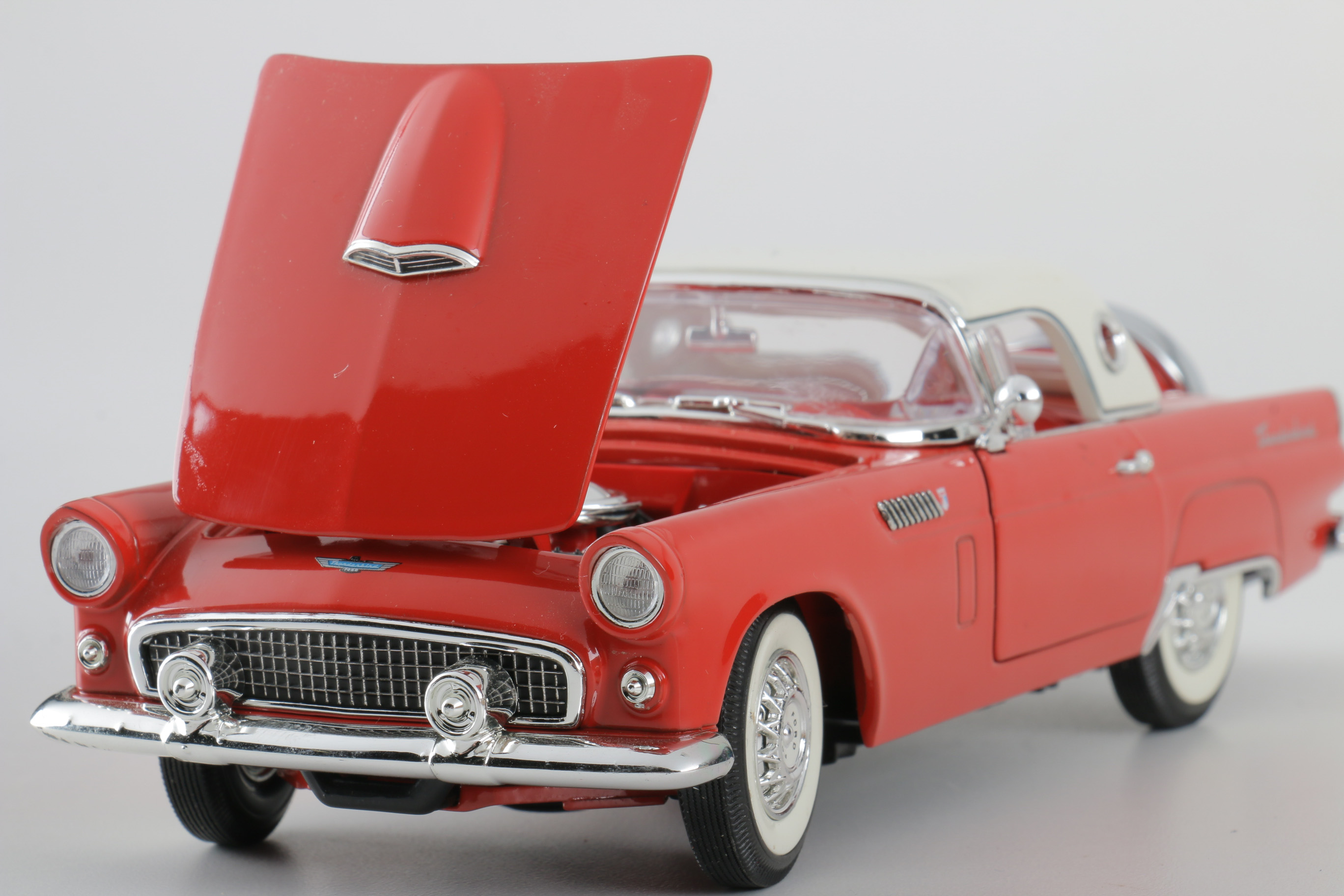 A collection of Four 1:24 Scale Ford Thunderbirds