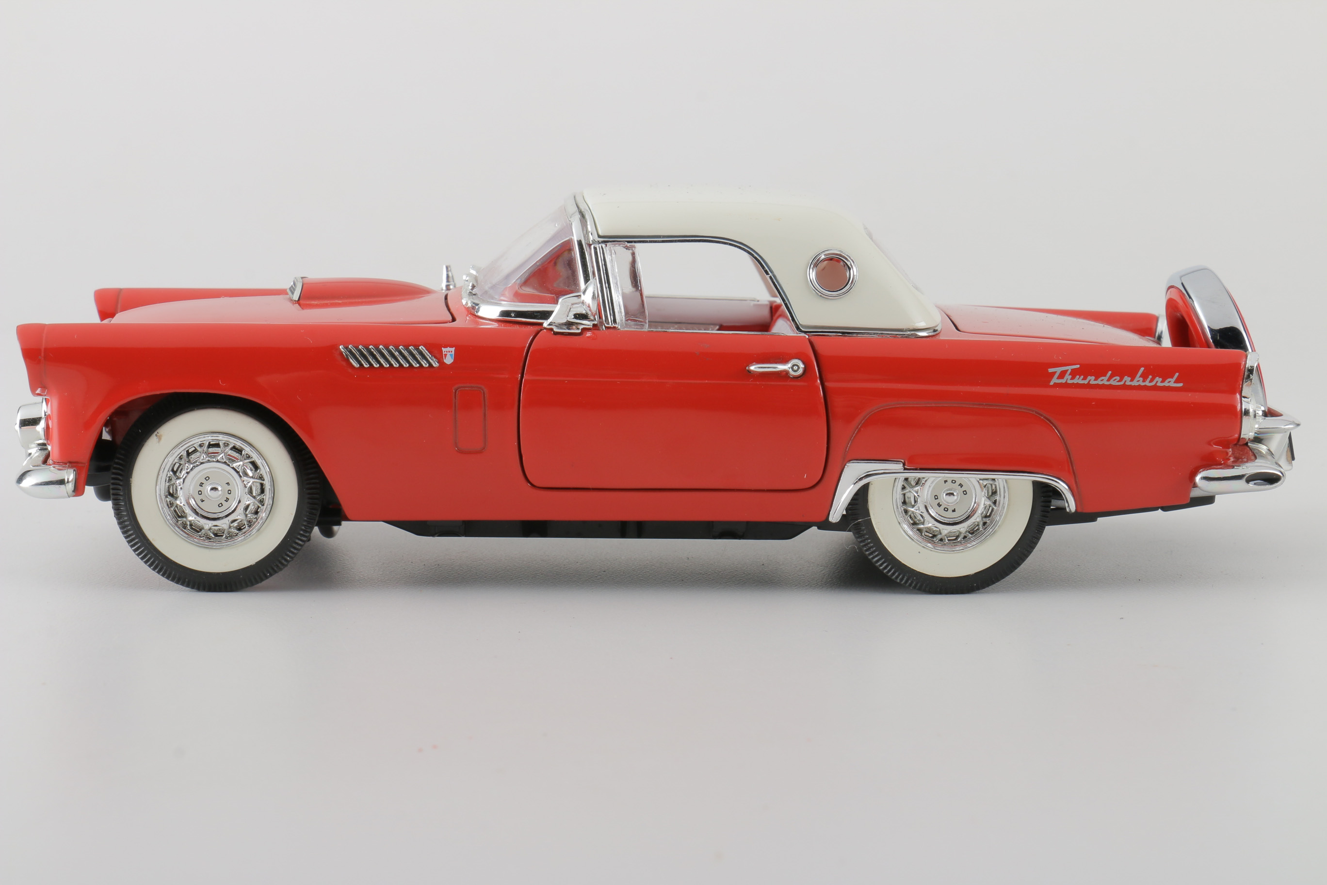 A collection of Four 1:24 Scale Ford Thunderbirds