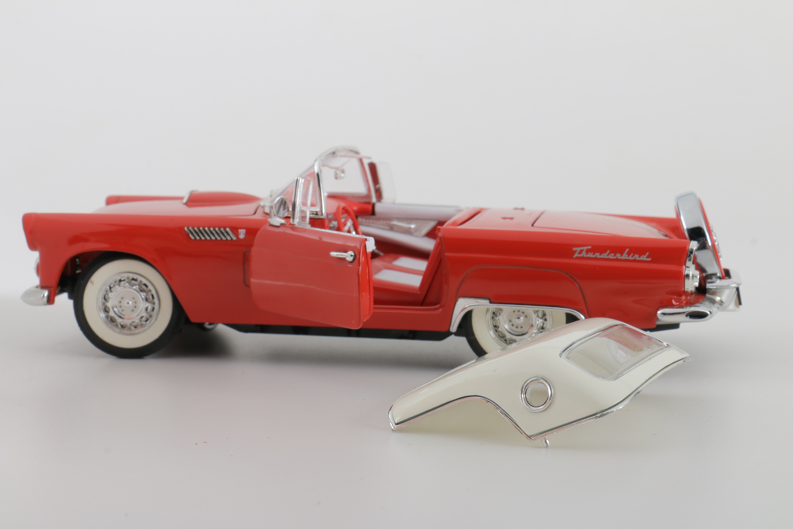 A collection of Four 1:24 Scale Ford Thunderbirds