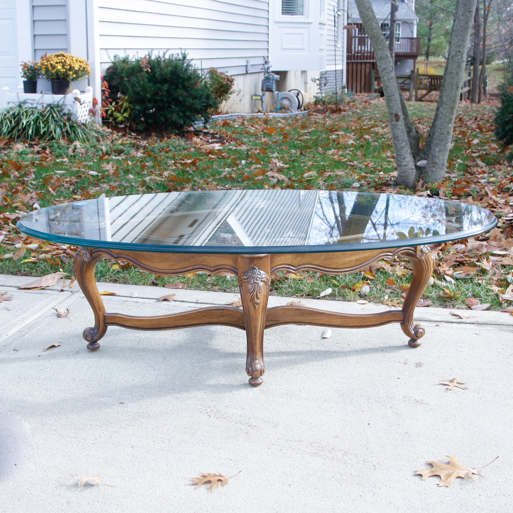 Oval Glass Top Coffee Table with Carved Wood Base
