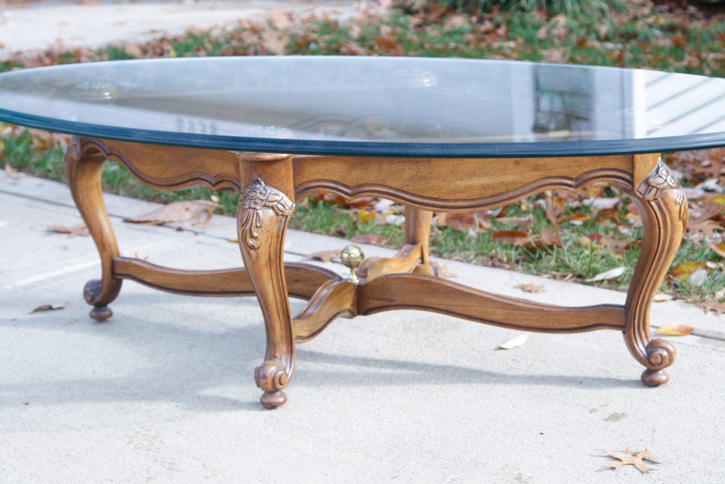 Oval Glass Top Coffee Table with Carved Wood Base