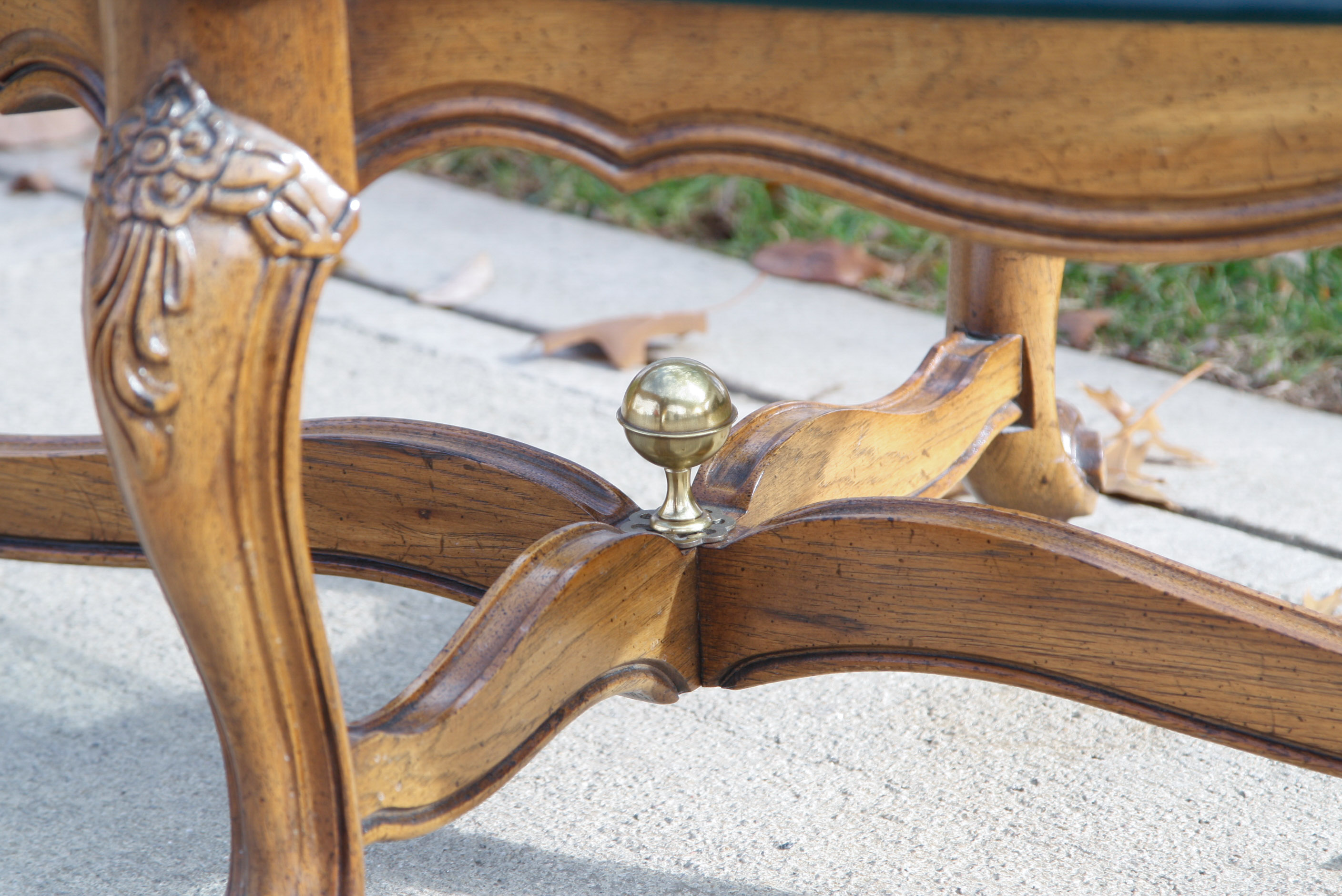 Oval Glass Top Coffee Table with Carved Wood Base