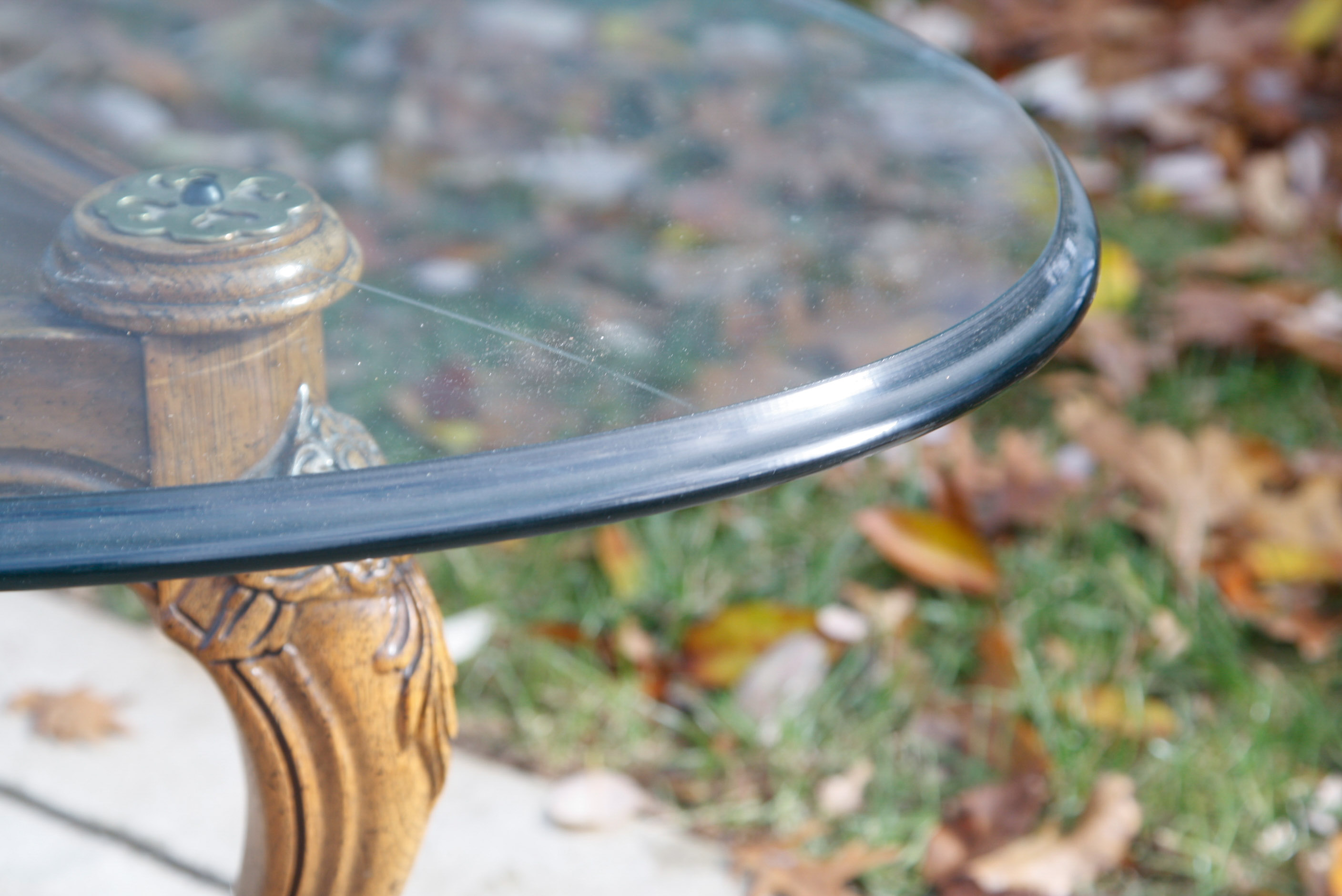 Oval Glass Top Coffee Table with Carved Wood Base