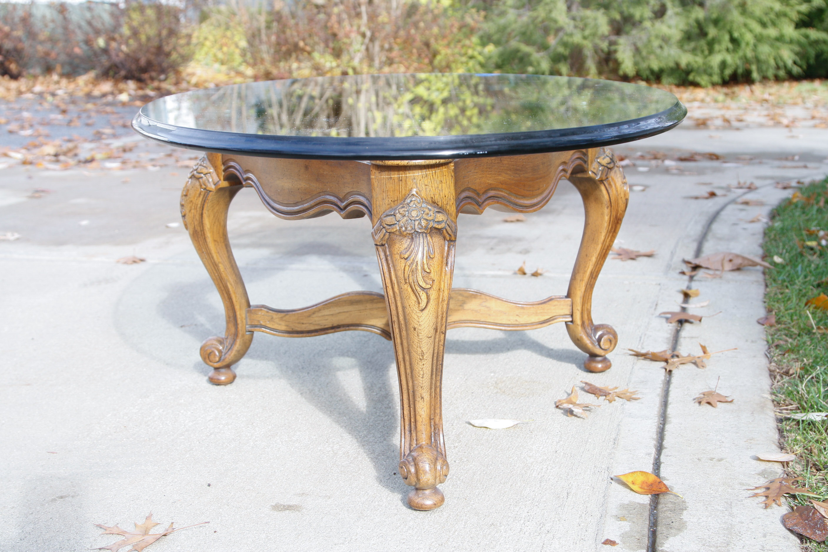 Oval Glass Top Coffee Table with Carved Wood Base