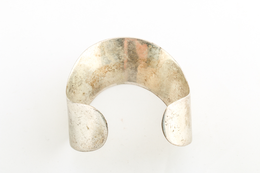 Collection of Metal Bracelets and a Pin