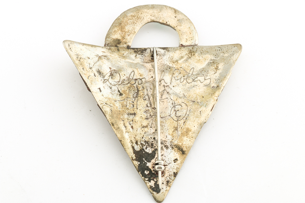 Collection of Metal Bracelets and a Pin