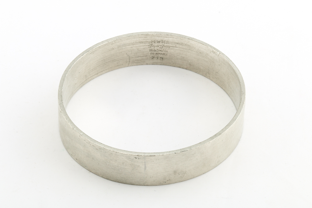 Collection of Metal Bracelets and a Pin