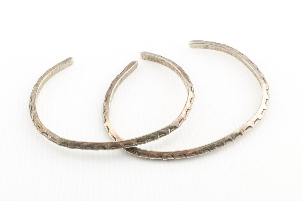 Collection of Metal Bracelets and a Pin