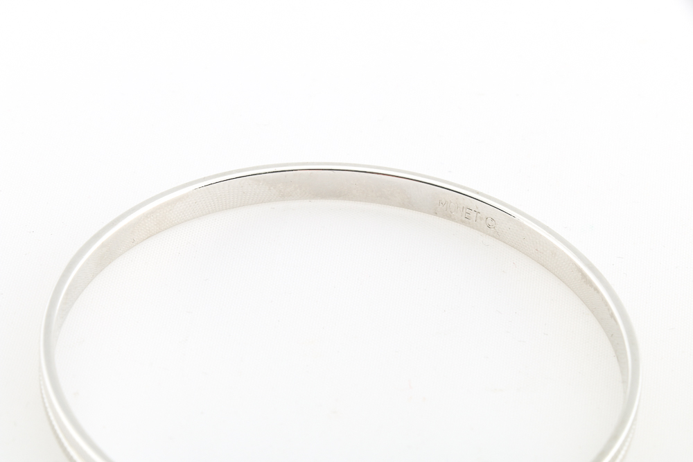 Collection of Metal Bracelets and a Pin