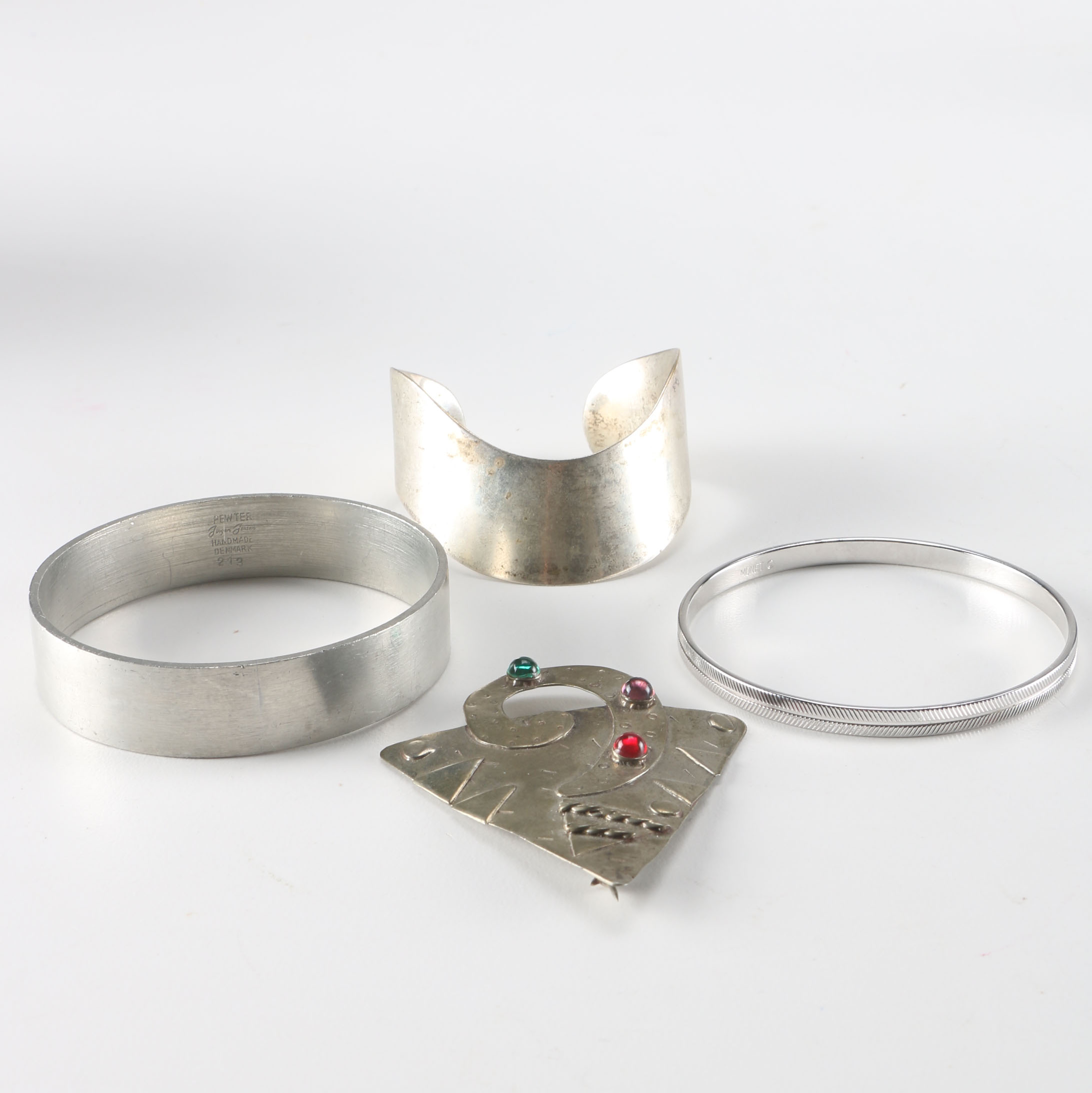 Collection of Metal Bracelets and a Pin