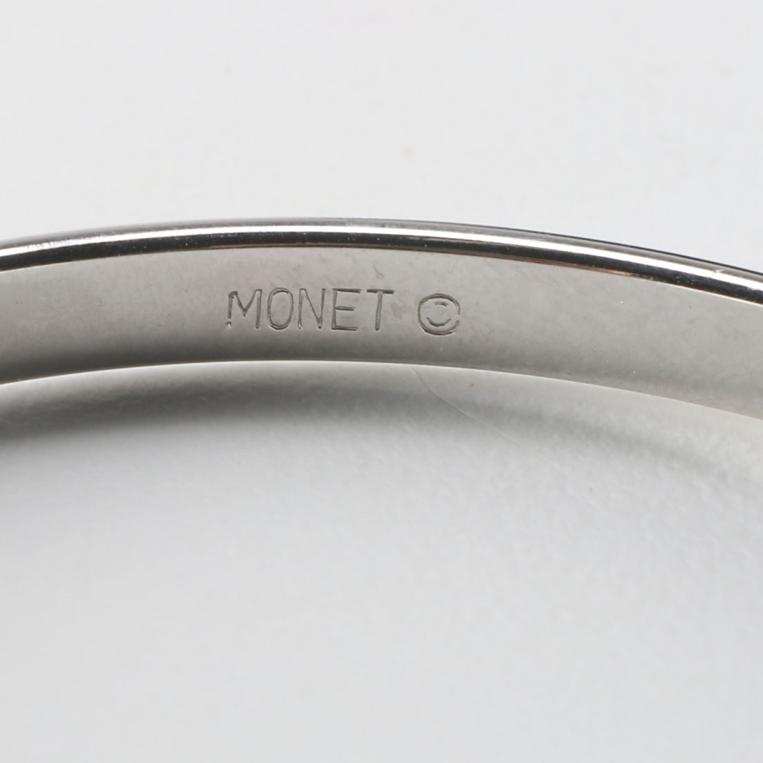 Collection of Metal Bracelets and a Pin