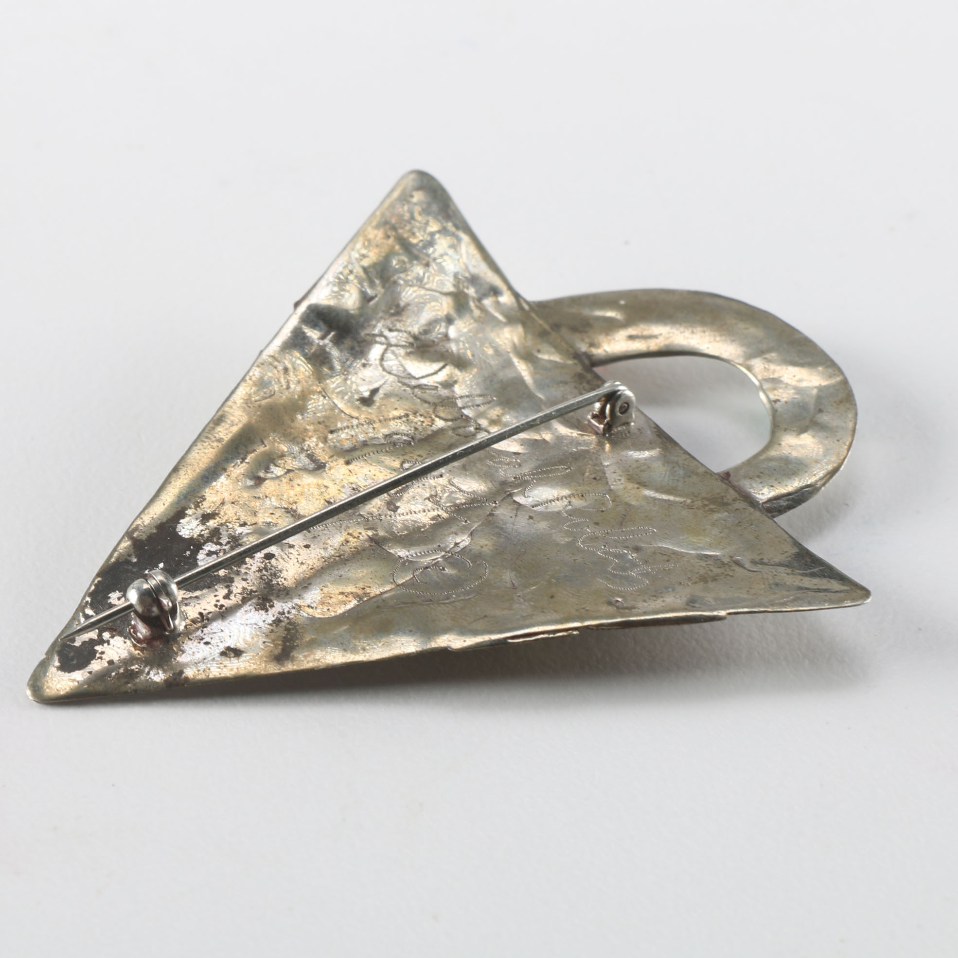 Collection of Metal Bracelets and a Pin