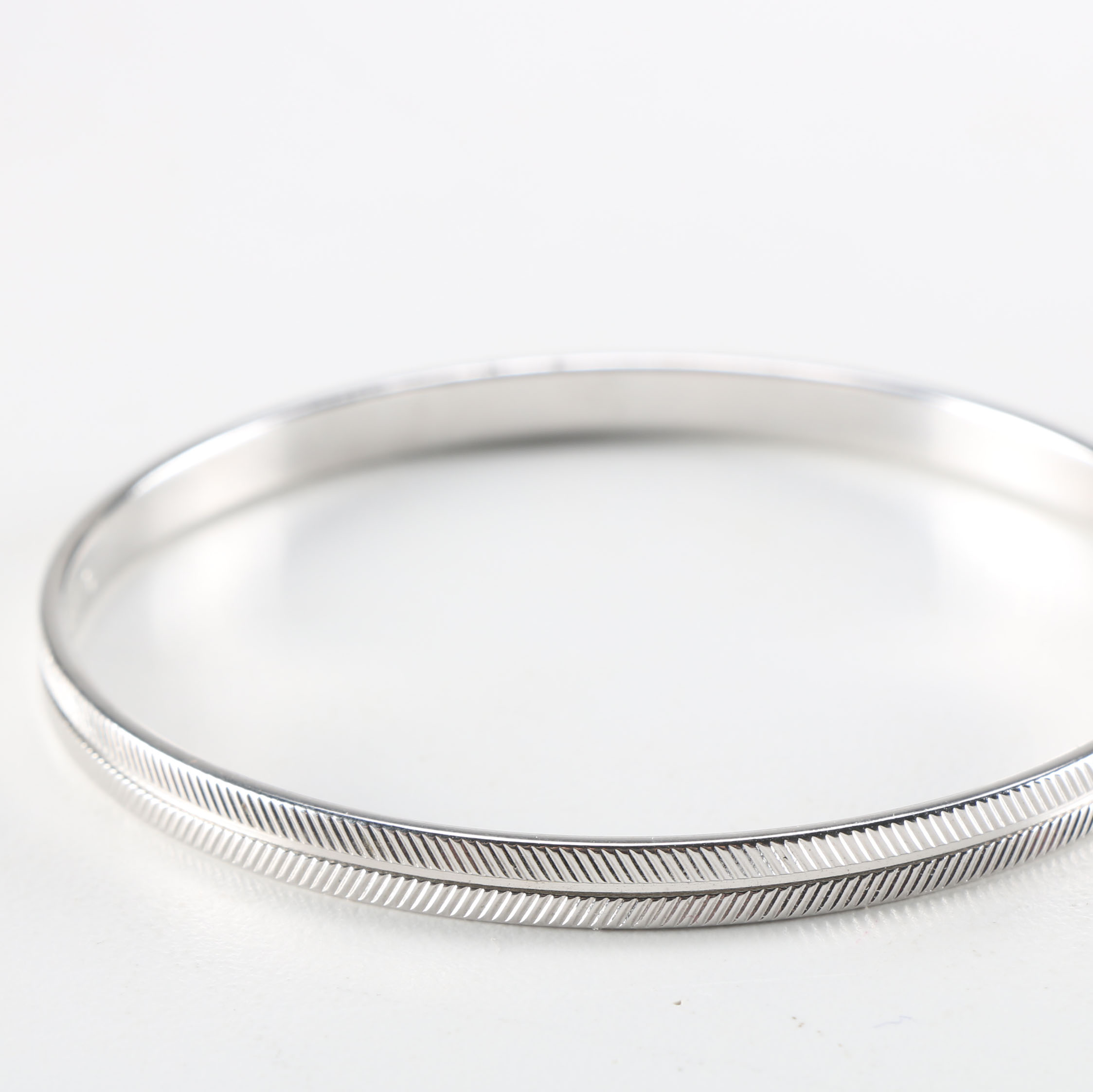 Collection of Metal Bracelets and a Pin