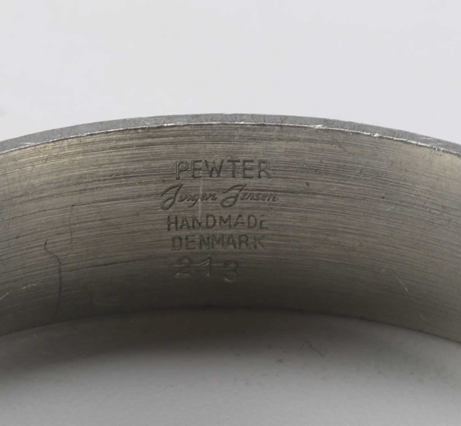 Collection of Metal Bracelets and a Pin