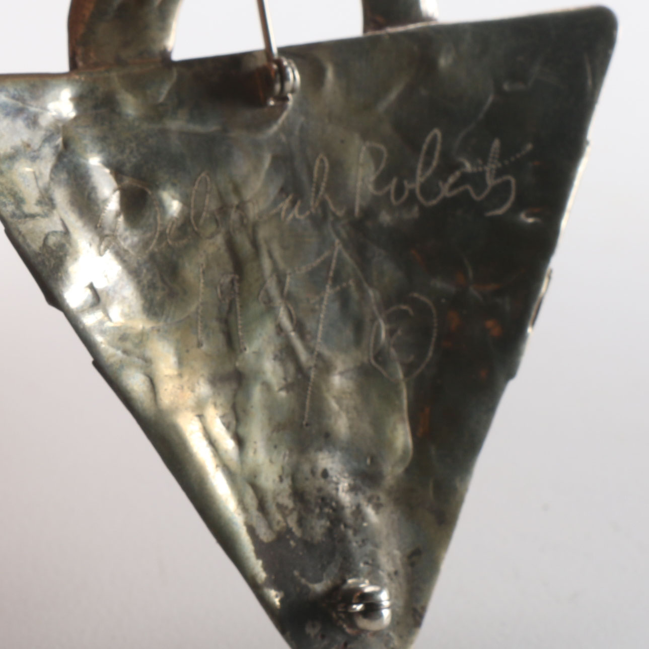 Collection of Metal Bracelets and a Pin