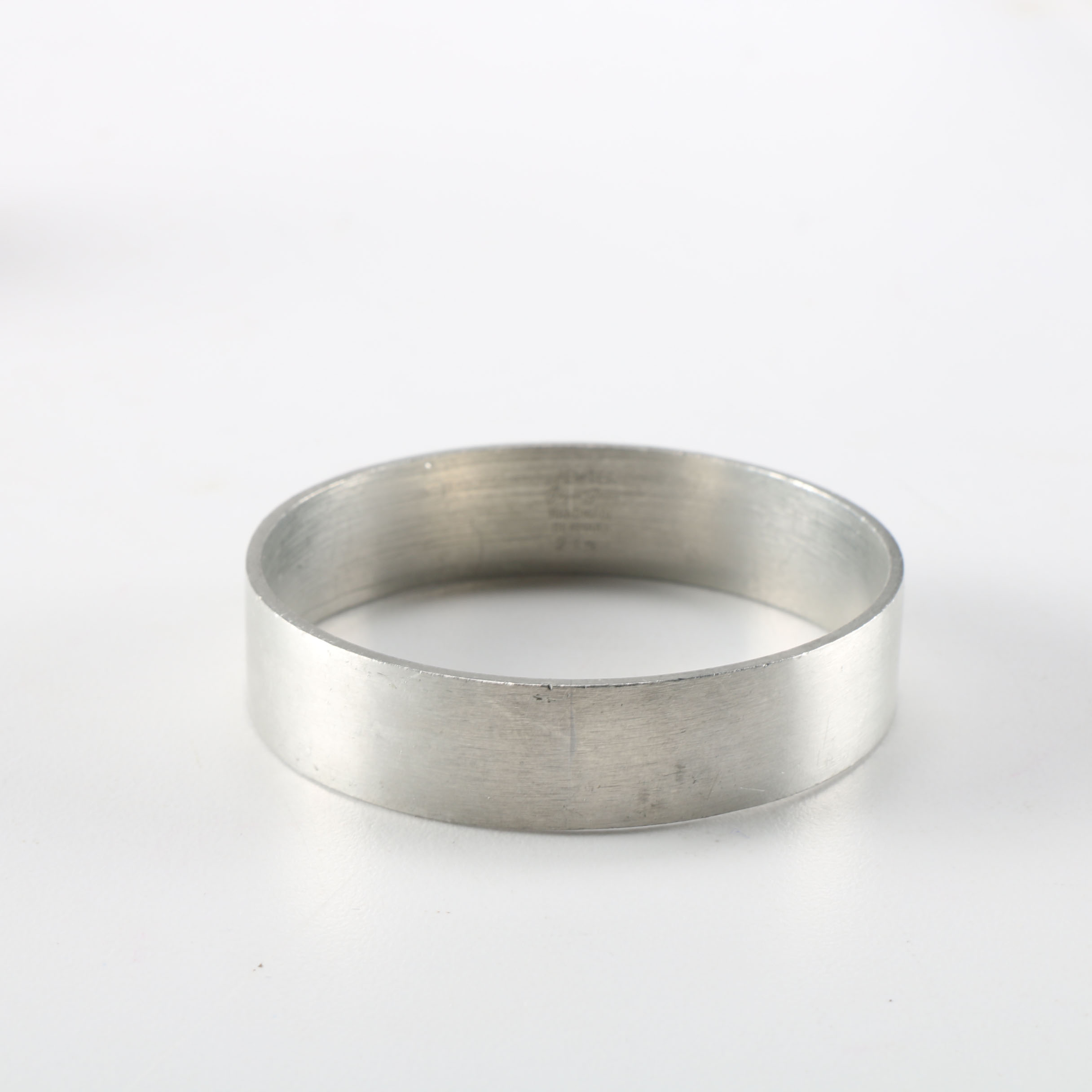 Collection of Metal Bracelets and a Pin