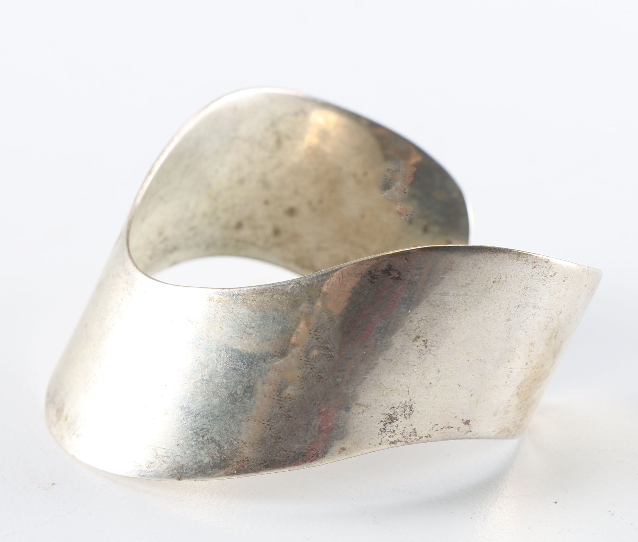 Collection of Metal Bracelets and a Pin