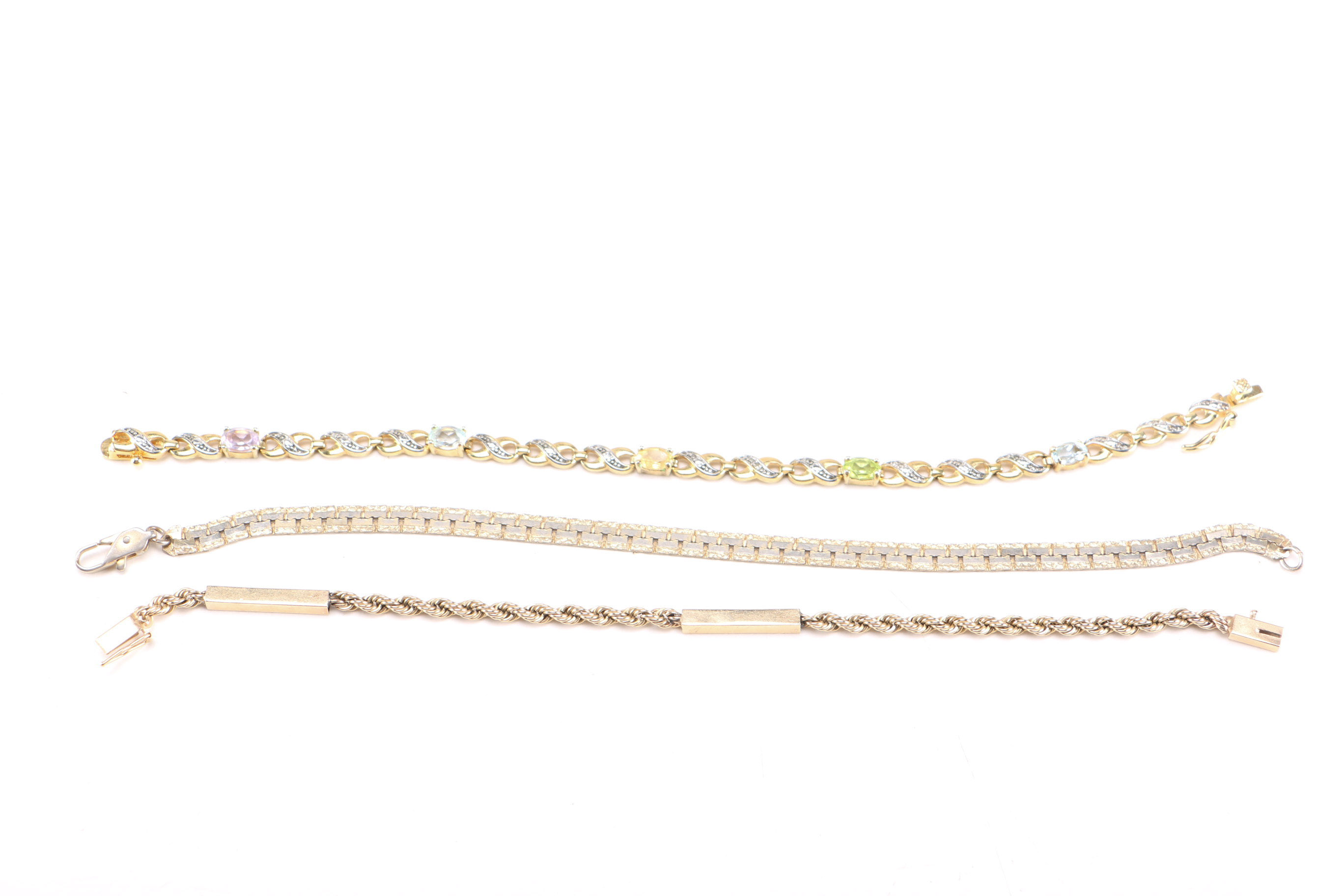 Collection of Gold Toned Metal Bracelets