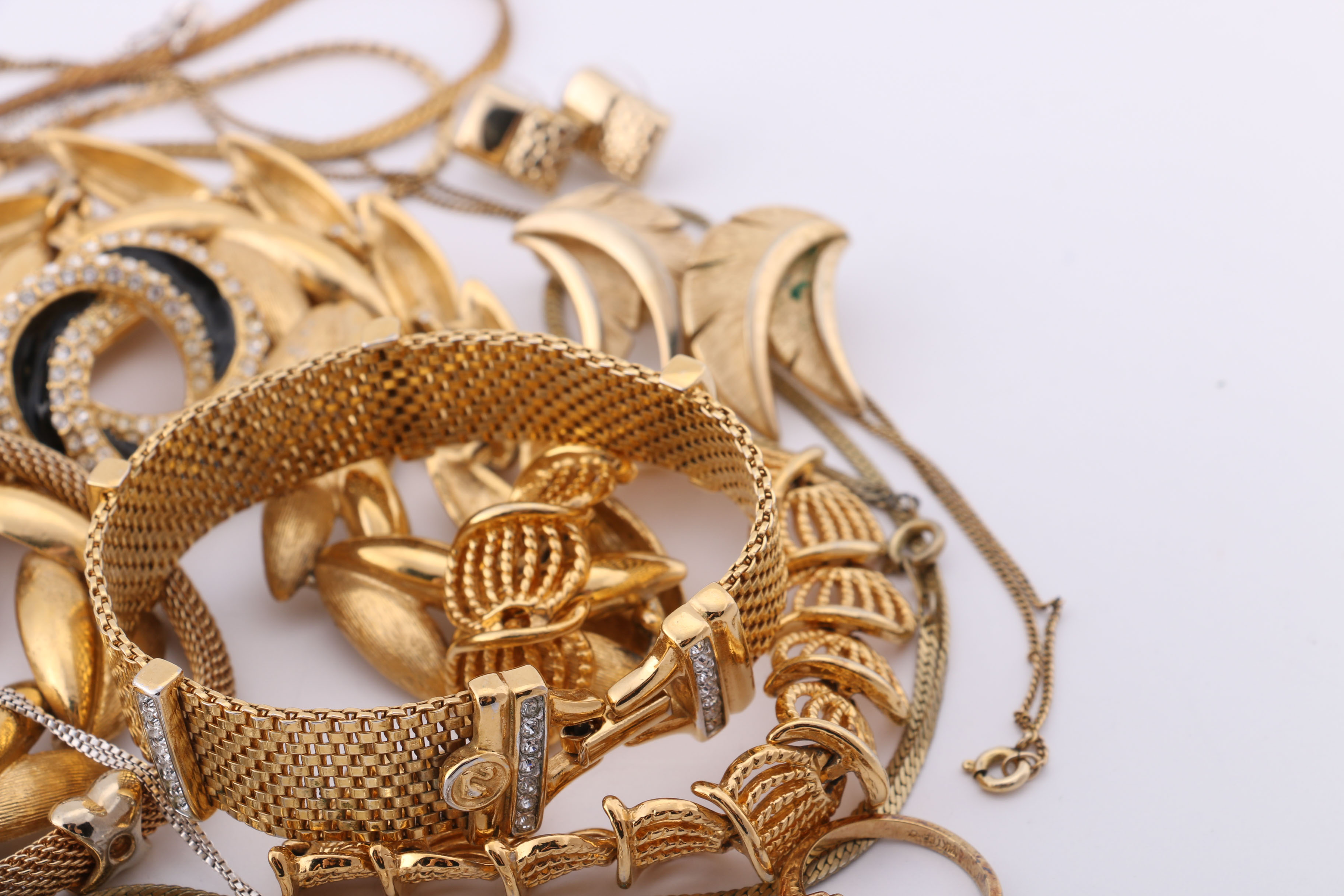 Gold and Silver Tone Trifari, Swarovski, and Napier Jewelry