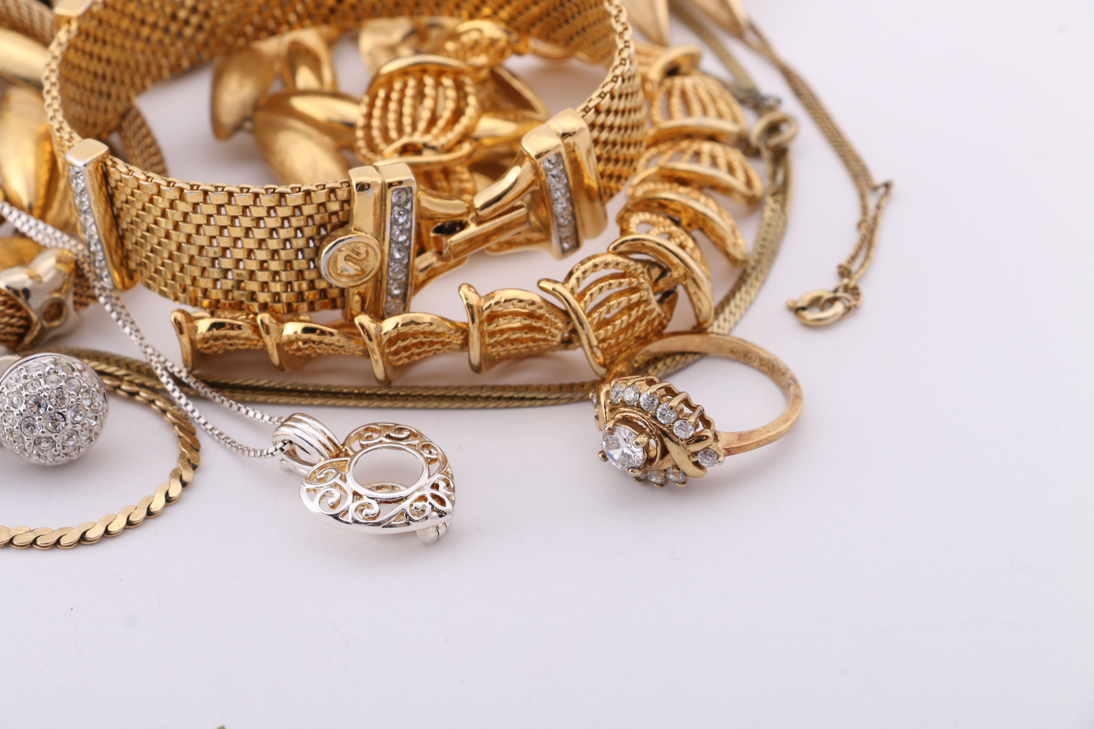 Gold and Silver Tone Trifari, Swarovski, and Napier Jewelry