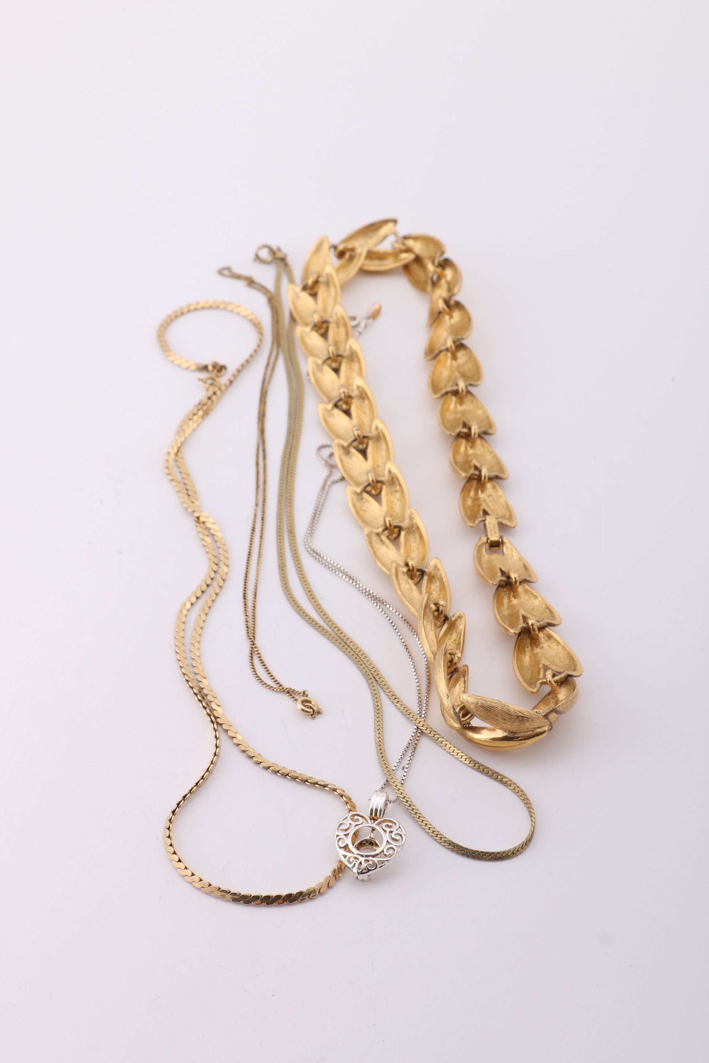 Gold and Silver Tone Trifari, Swarovski, and Napier Jewelry