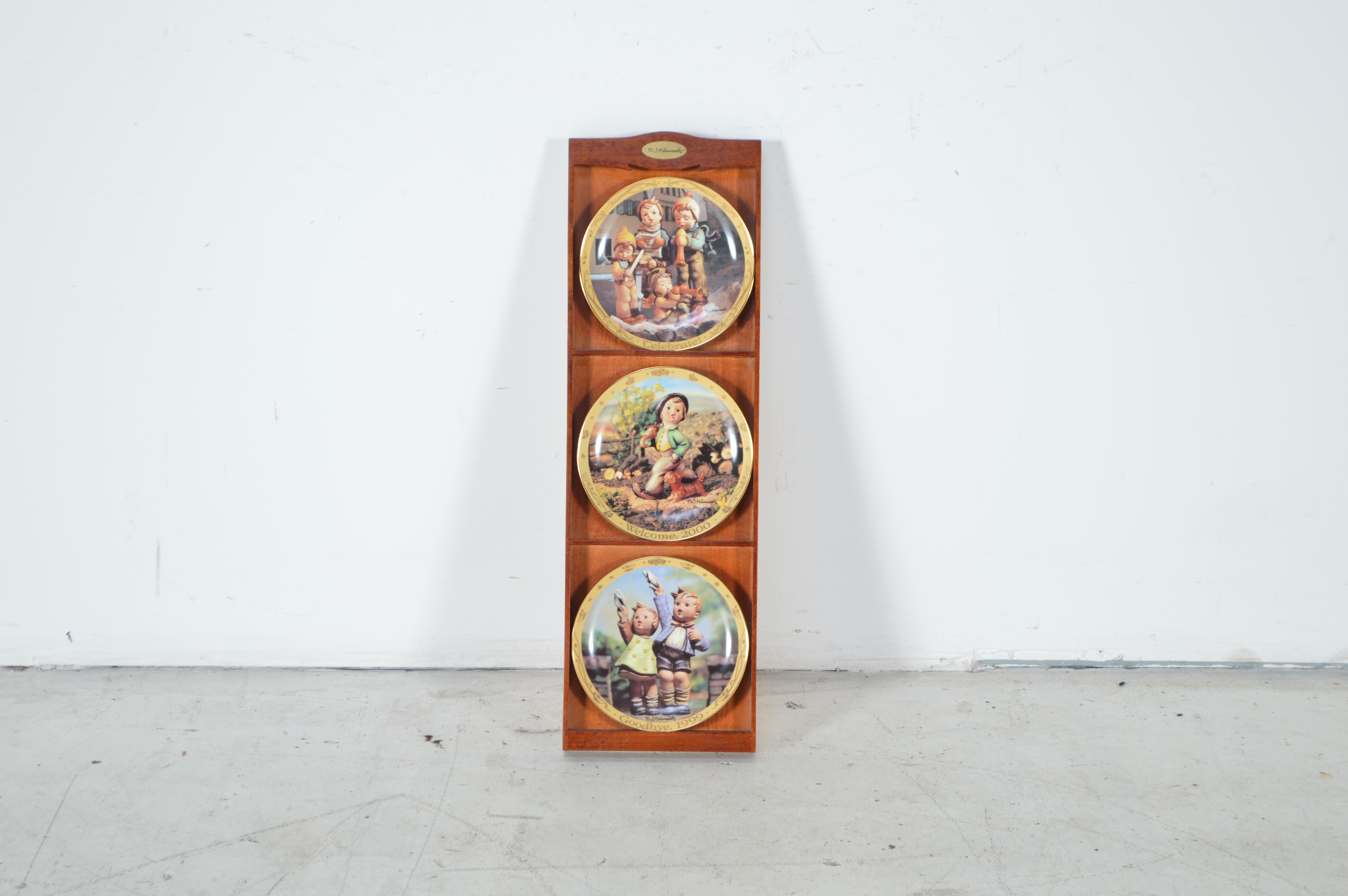 Hummel Plates in Wooden Display