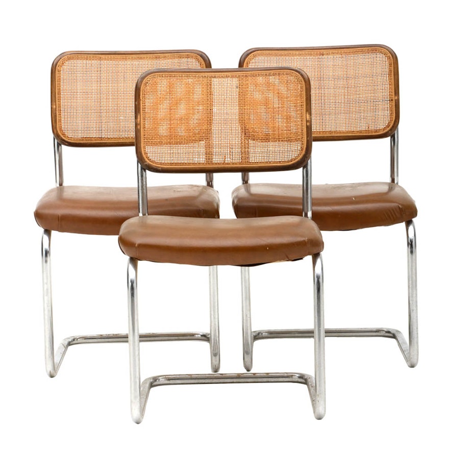 Three Cantilevered Side Chairs with Woven Cane Backs