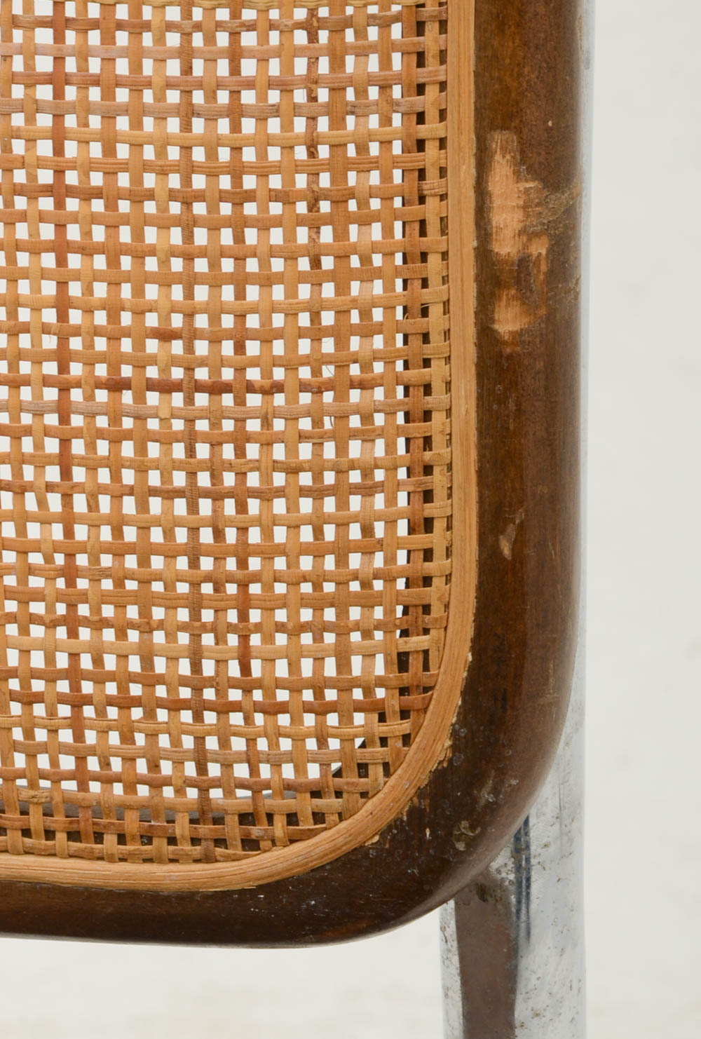 Three Cantilevered Side Chairs with Woven Cane Backs