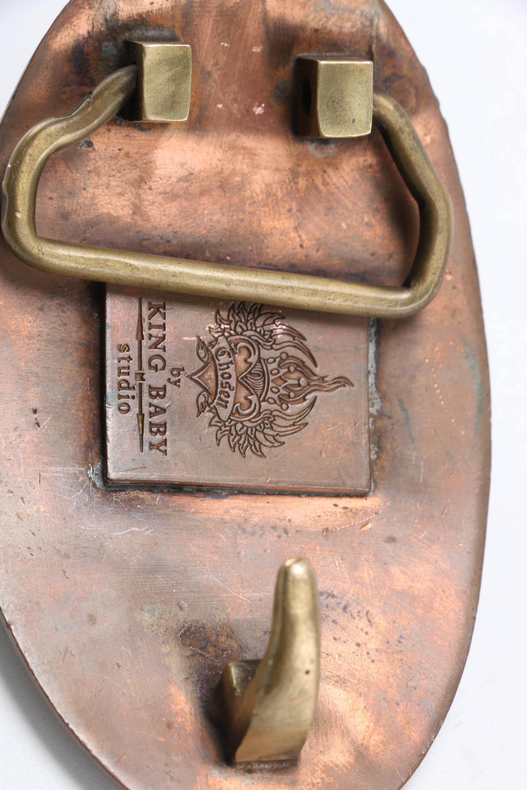 Men's Accessories Including a Leather Belt and Several Belt Buckles