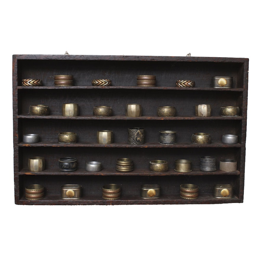 Collection of Napkin Rings and Wall Shelf