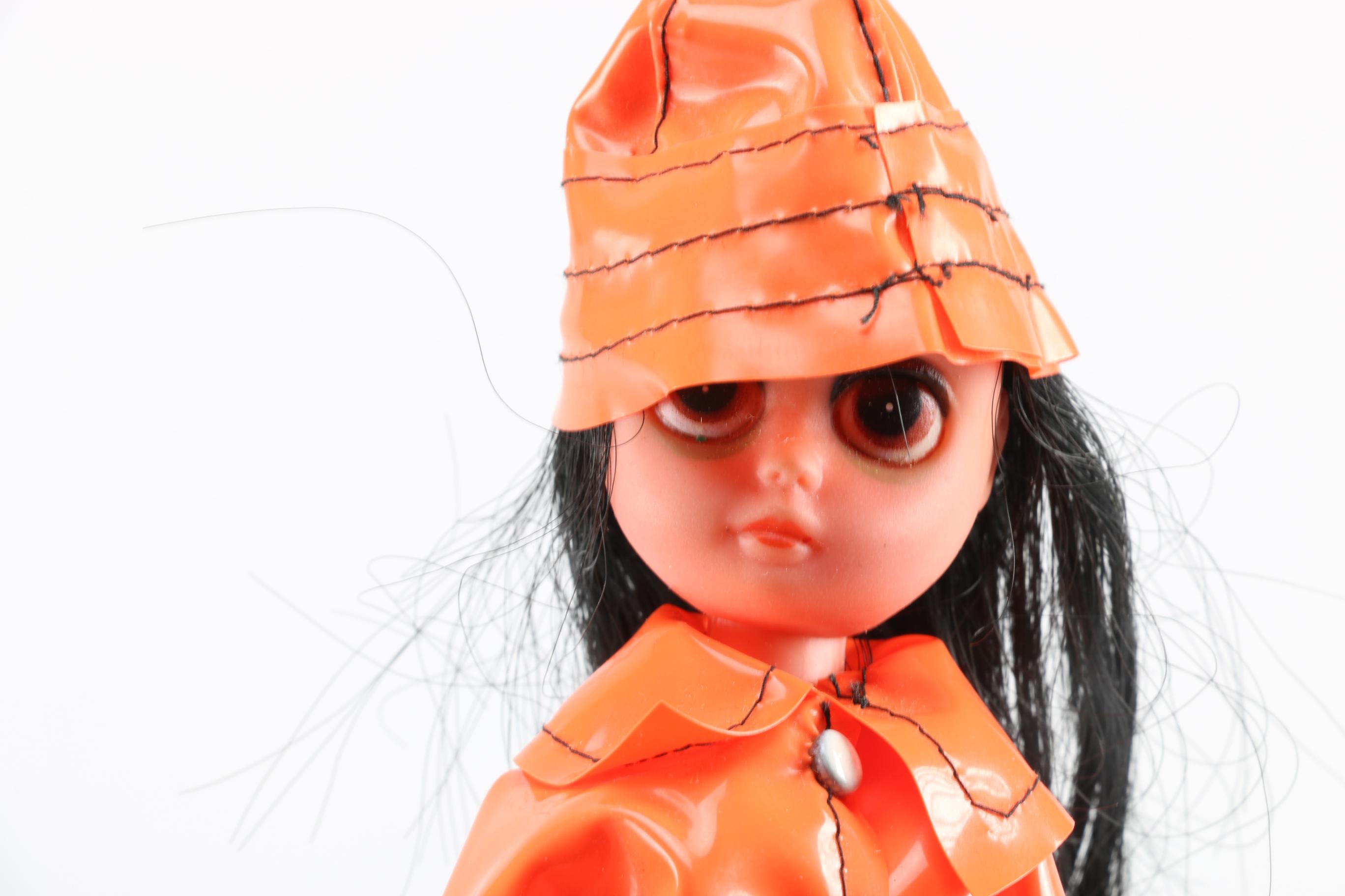 "Susie Slicker" Vinyl Doll with Orange Raincoat