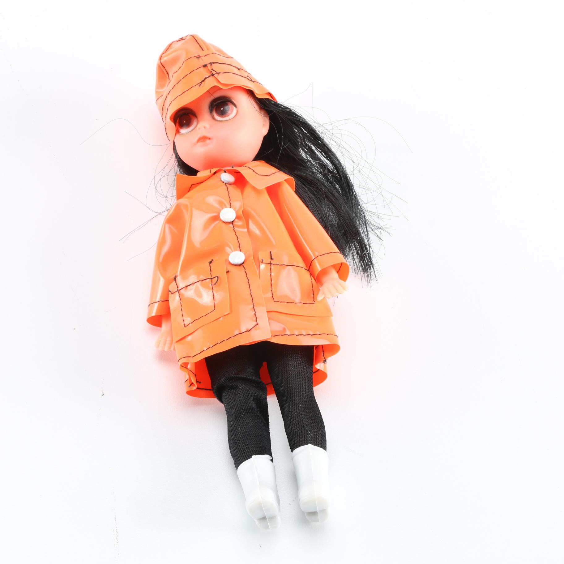 "Susie Slicker" Vinyl Doll with Orange Raincoat