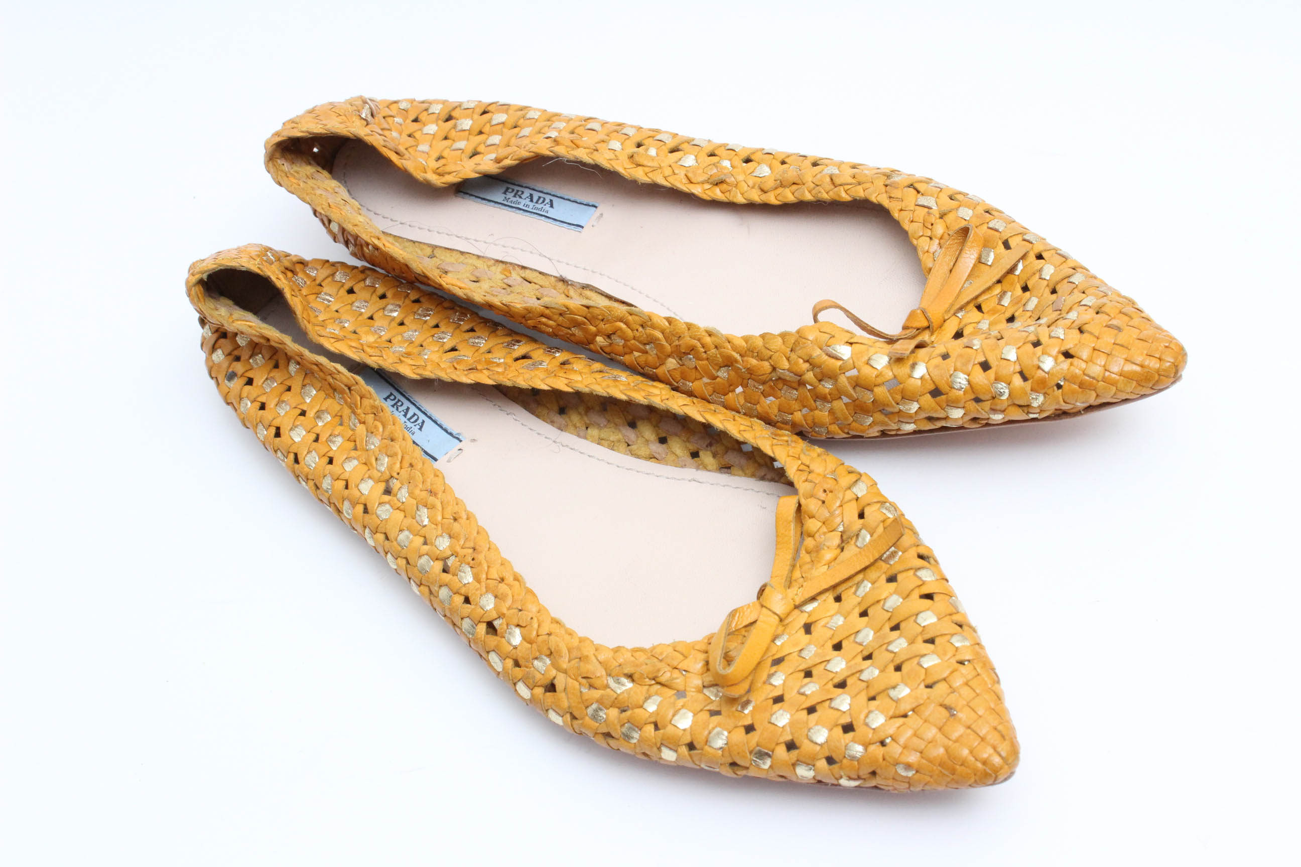 Designer Flats Featuring Prada and Tory Burch