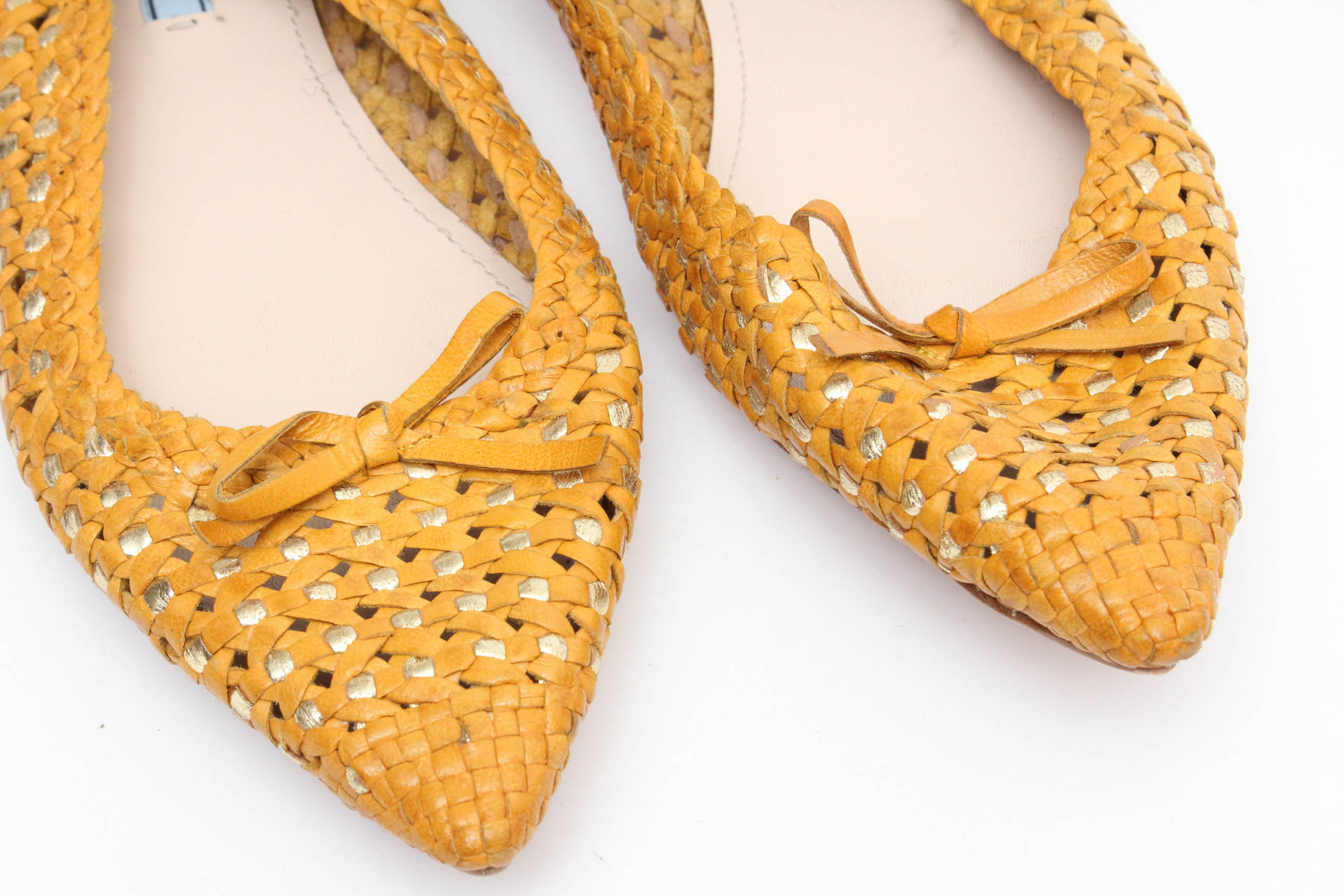 Designer Flats Featuring Prada and Tory Burch