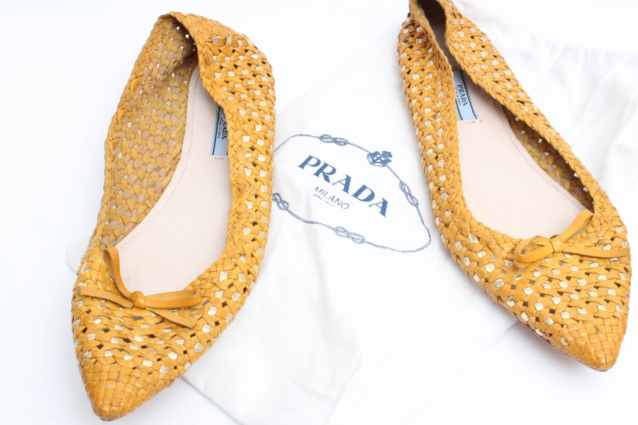 Designer Flats Featuring Prada and Tory Burch