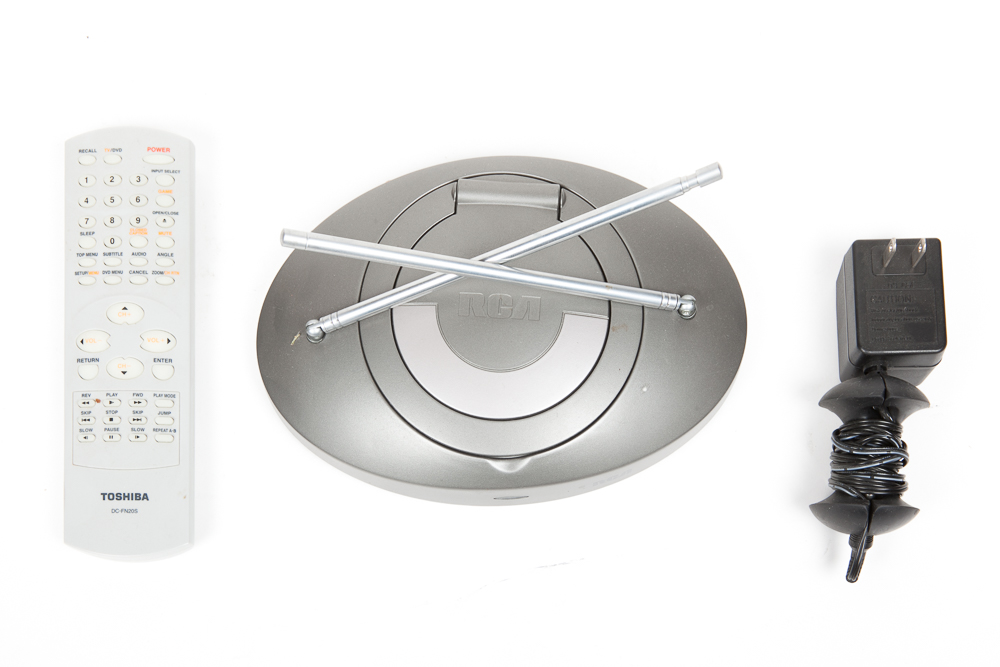 Toshiba 13" Television/DVD Player and 75 DVDs/Blu-ray Discs