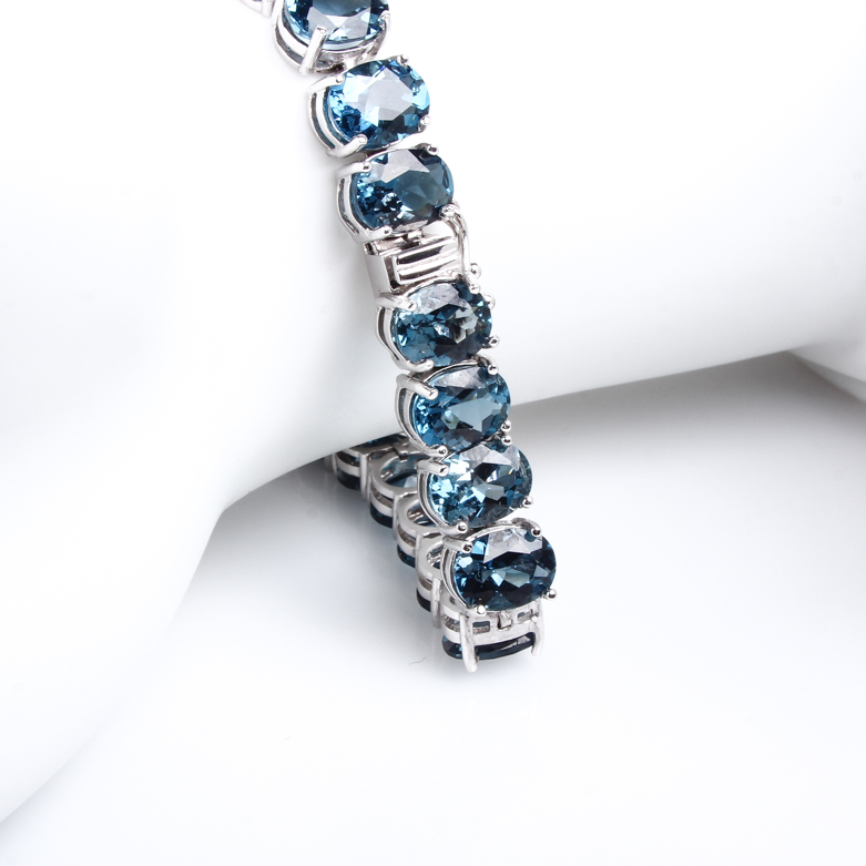 14K White Gold and Blue Topaz Tennis Bracelet