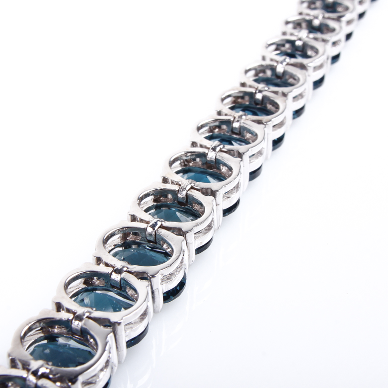 14K White Gold and Blue Topaz Tennis Bracelet