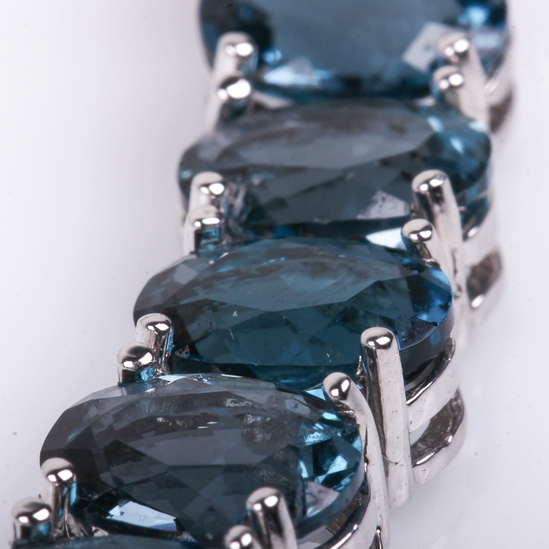 14K White Gold and Blue Topaz Tennis Bracelet