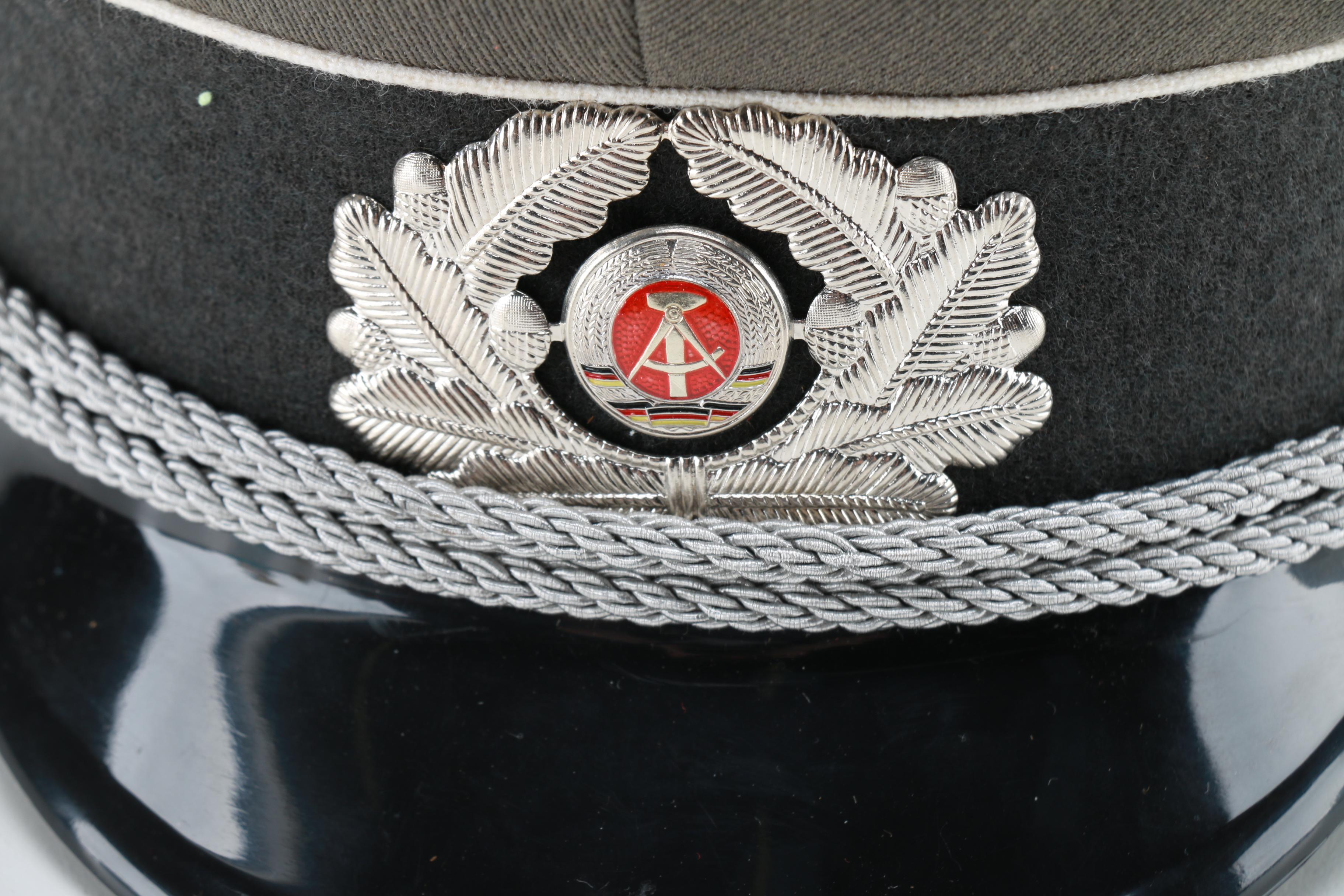 East German Officer and Russian Police Hats