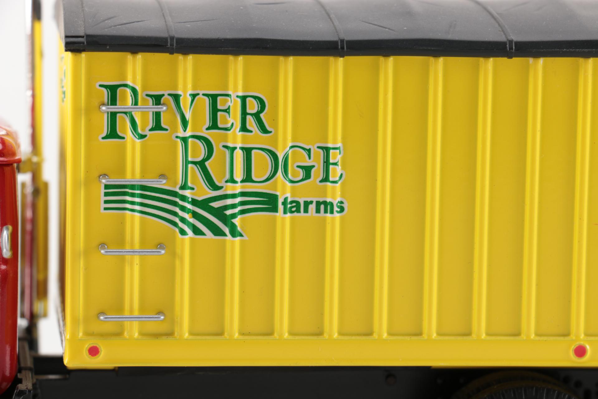 Pair of First Gear Die-Cast Mack Trucks