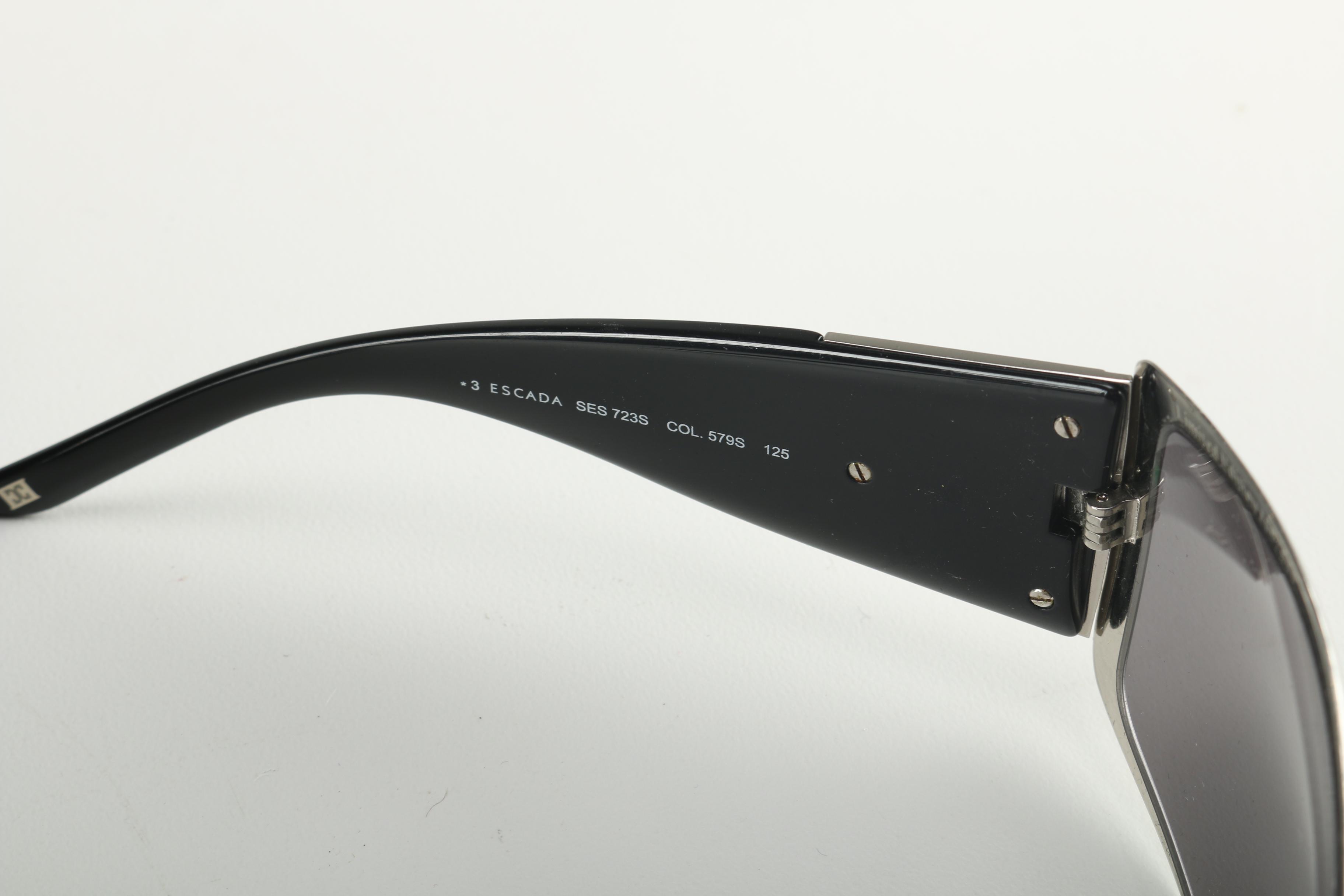 Sunglasses by Prada and Escada