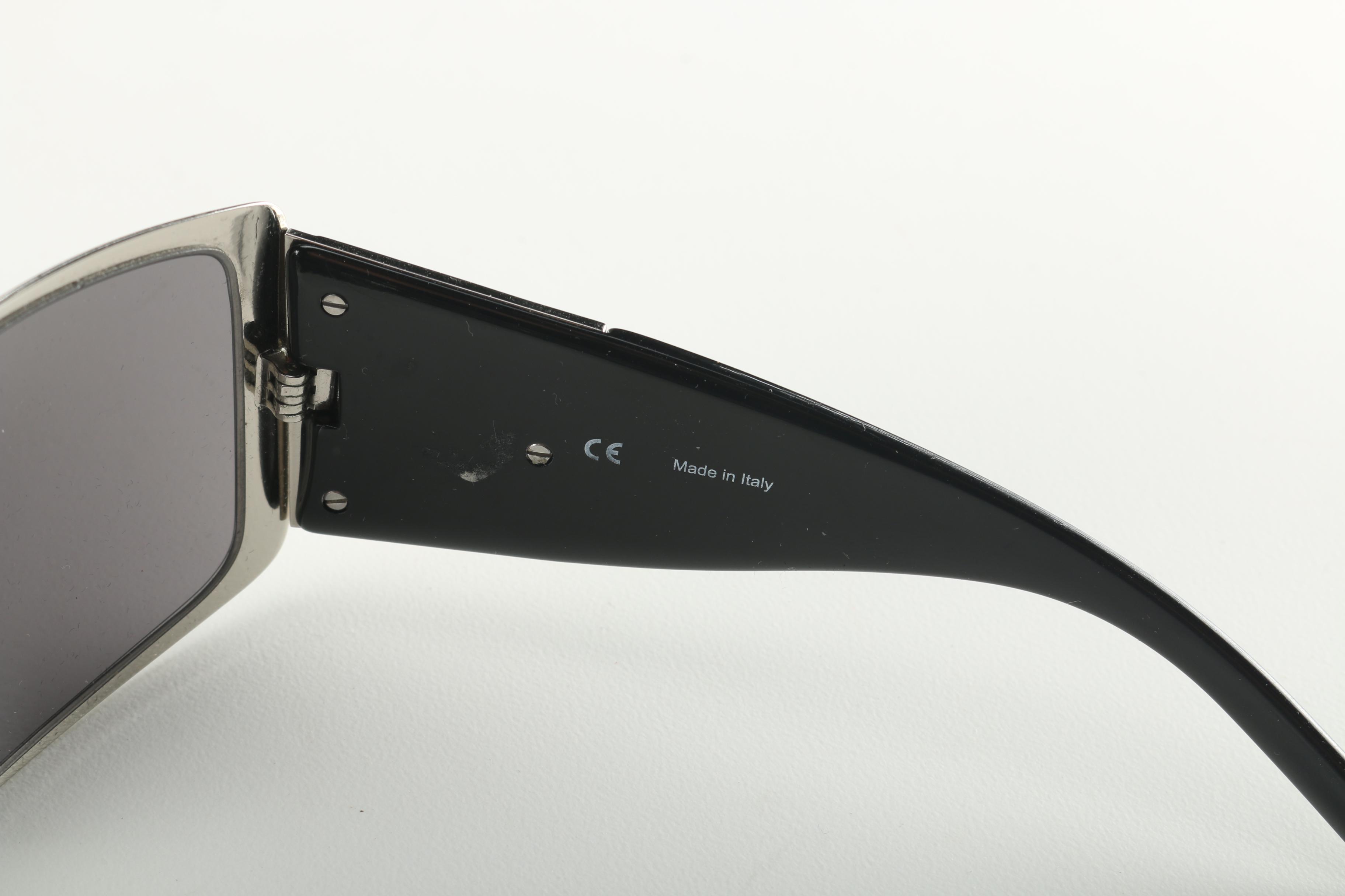 Sunglasses by Prada and Escada