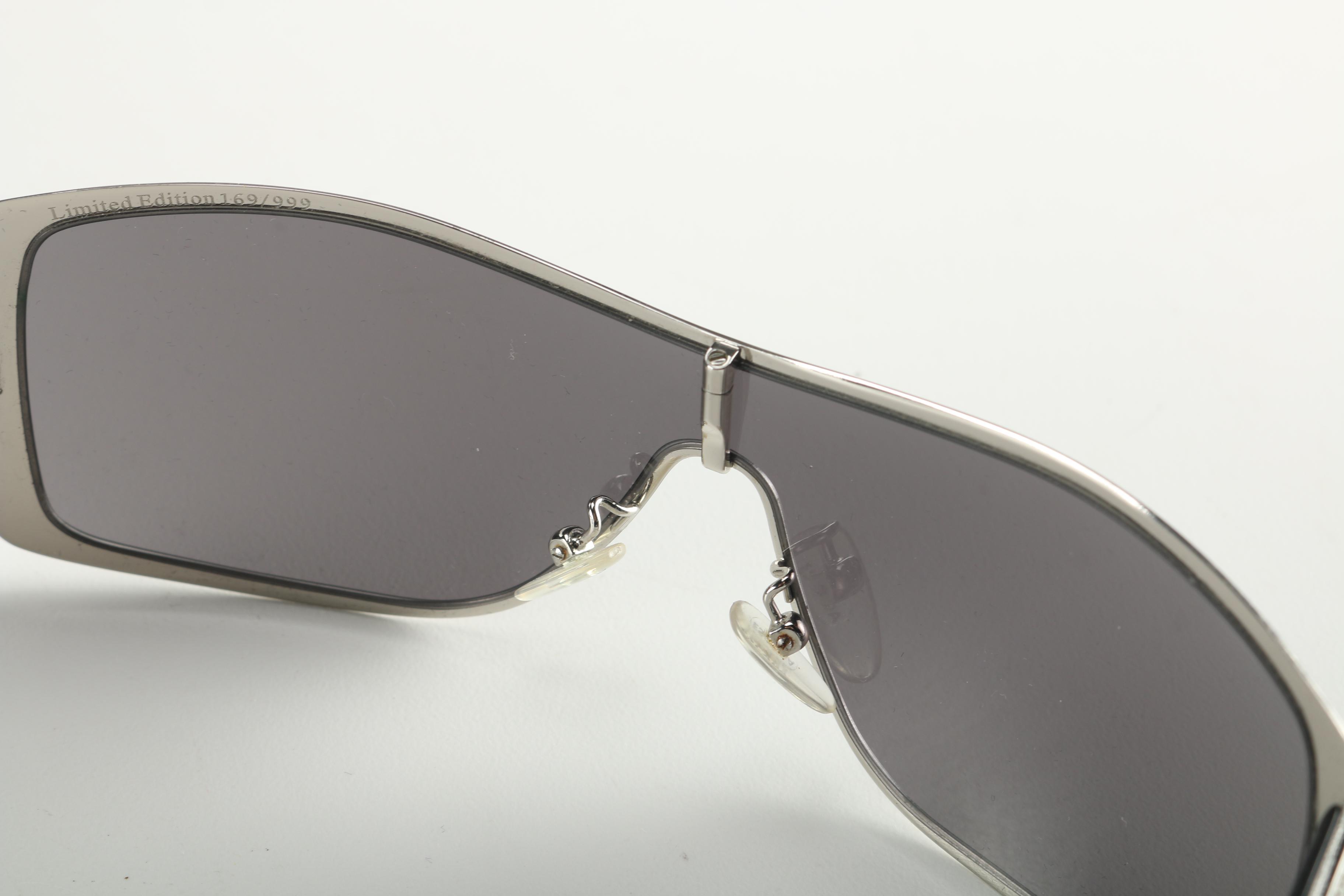 Sunglasses by Prada and Escada