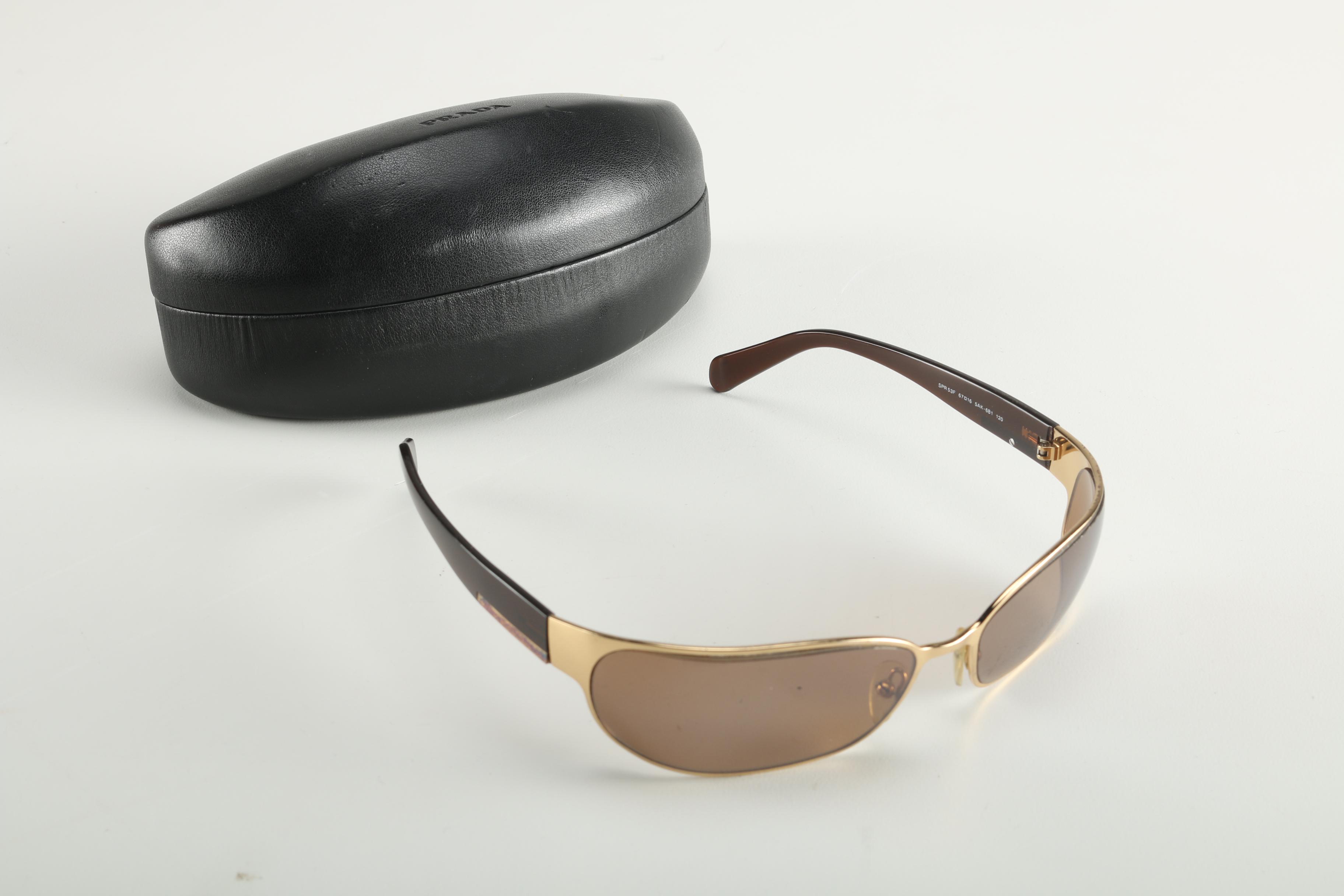 Sunglasses by Prada and Escada