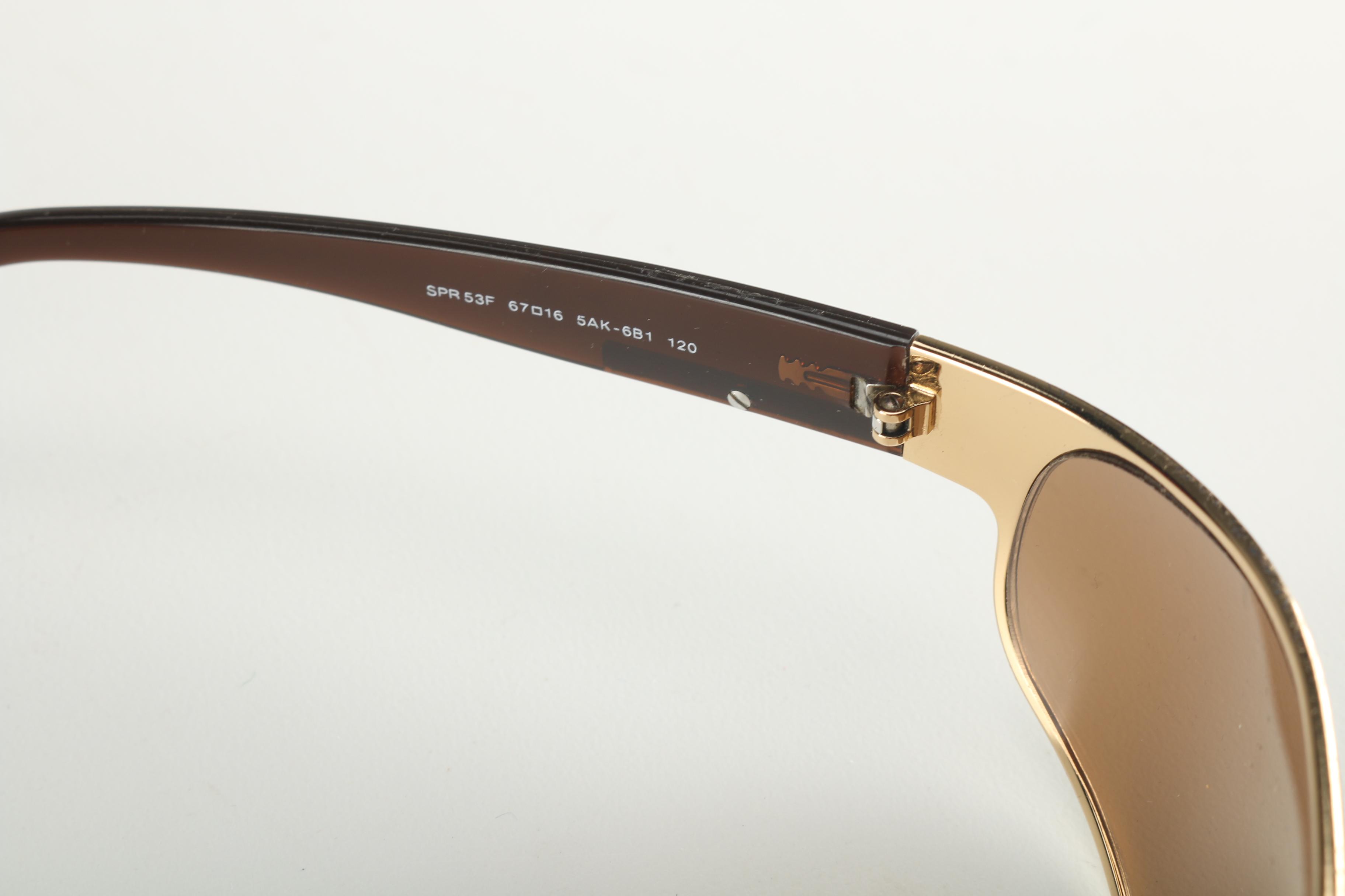 Sunglasses by Prada and Escada