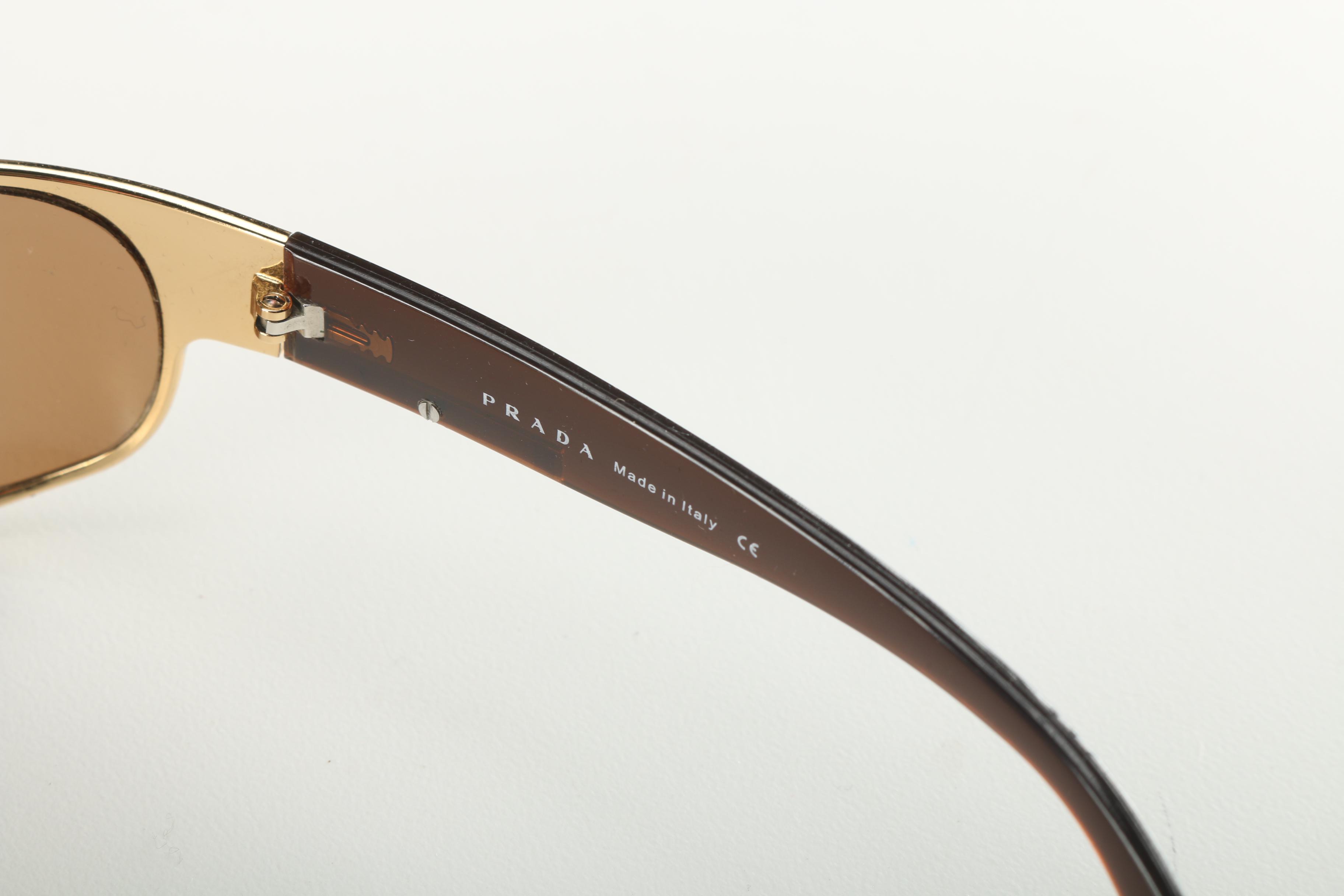 Sunglasses by Prada and Escada